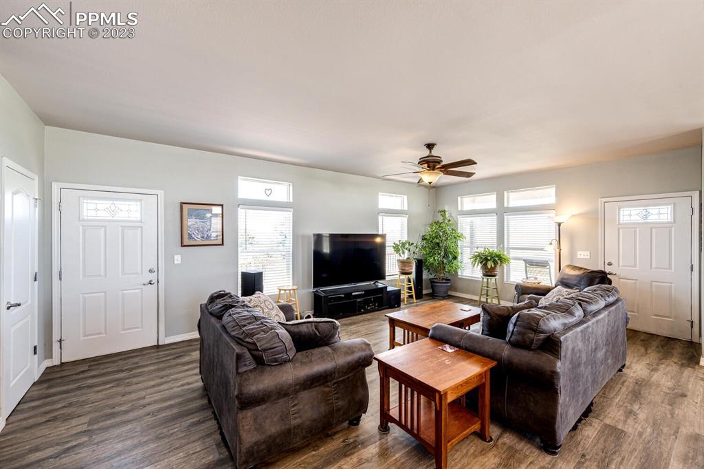 4685 County Road 106 Elbert, CO 80106 - Photo 10 of 43 a living room with furniture and a flat screen tv