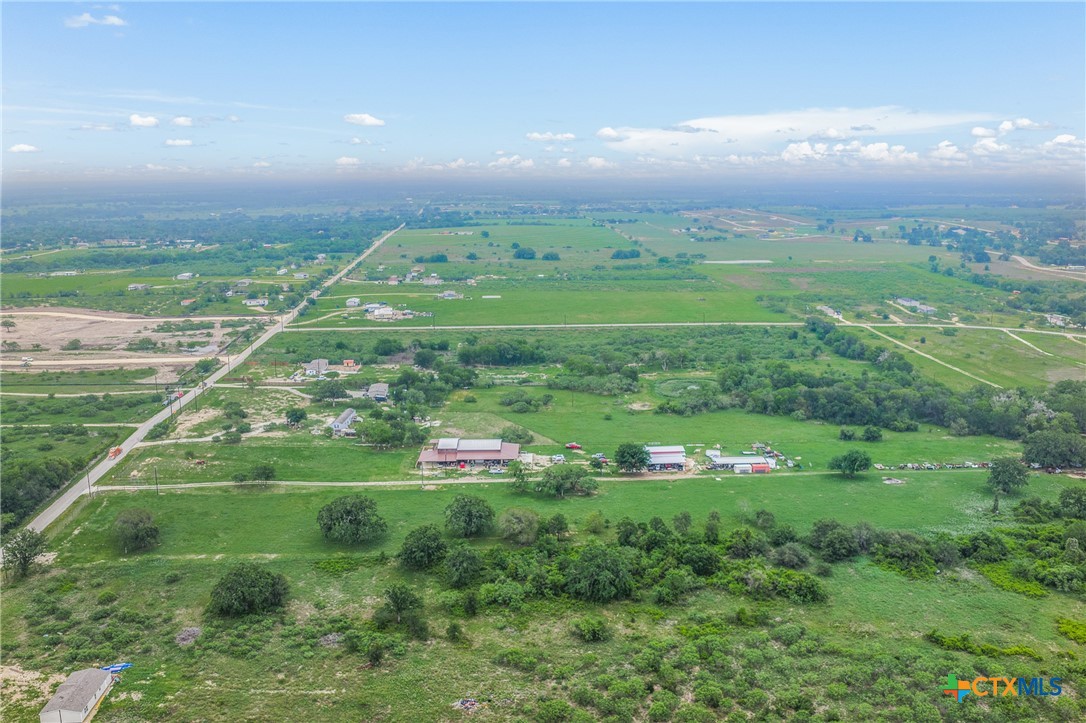 6497 Taylorsville Road Dale, TX 78616 - Photo 27 of 36 a green field with lots of tress in it