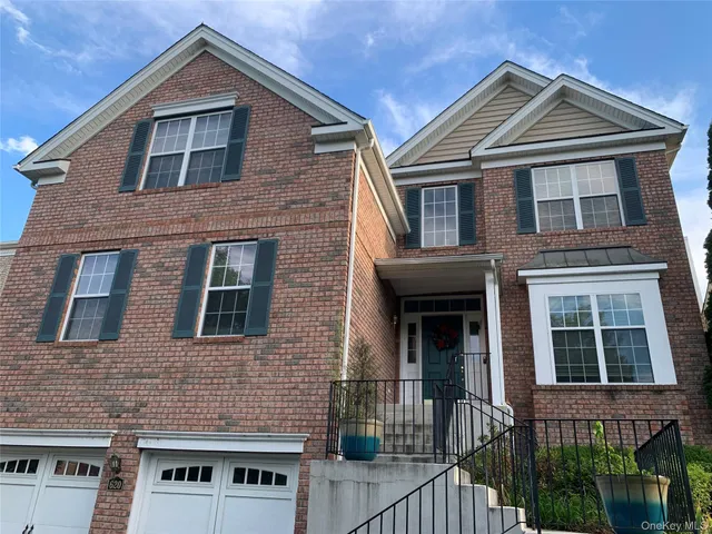 a front view of a house with glass windows