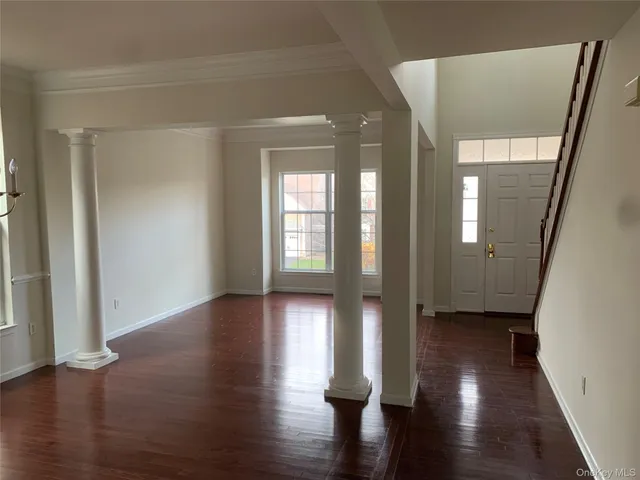a view of entryway with wooden floor