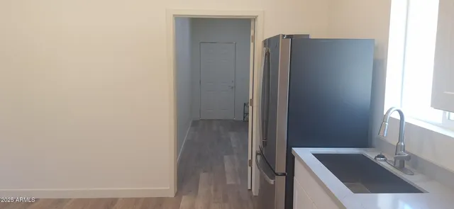 a bathroom with a tub sink and shower