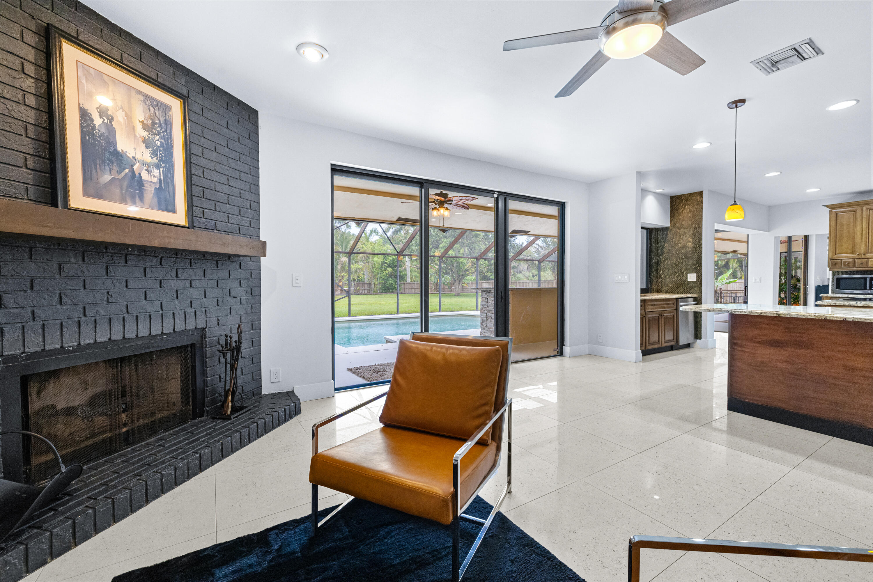 11415 Sundance Lane Boca Raton, FL 33428 - Photo 16 of 65 a living room with furniture and a fireplace