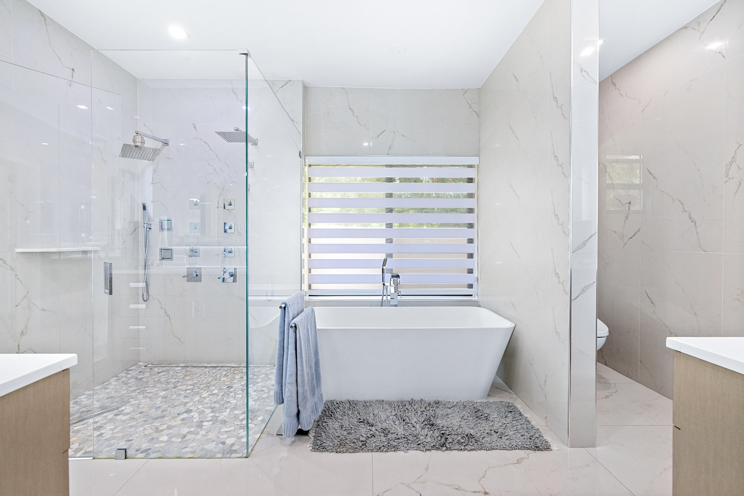 11415 Sundance Lane Boca Raton, FL 33428 - Photo 19 of 65 a bathroom with a bathtub and shower