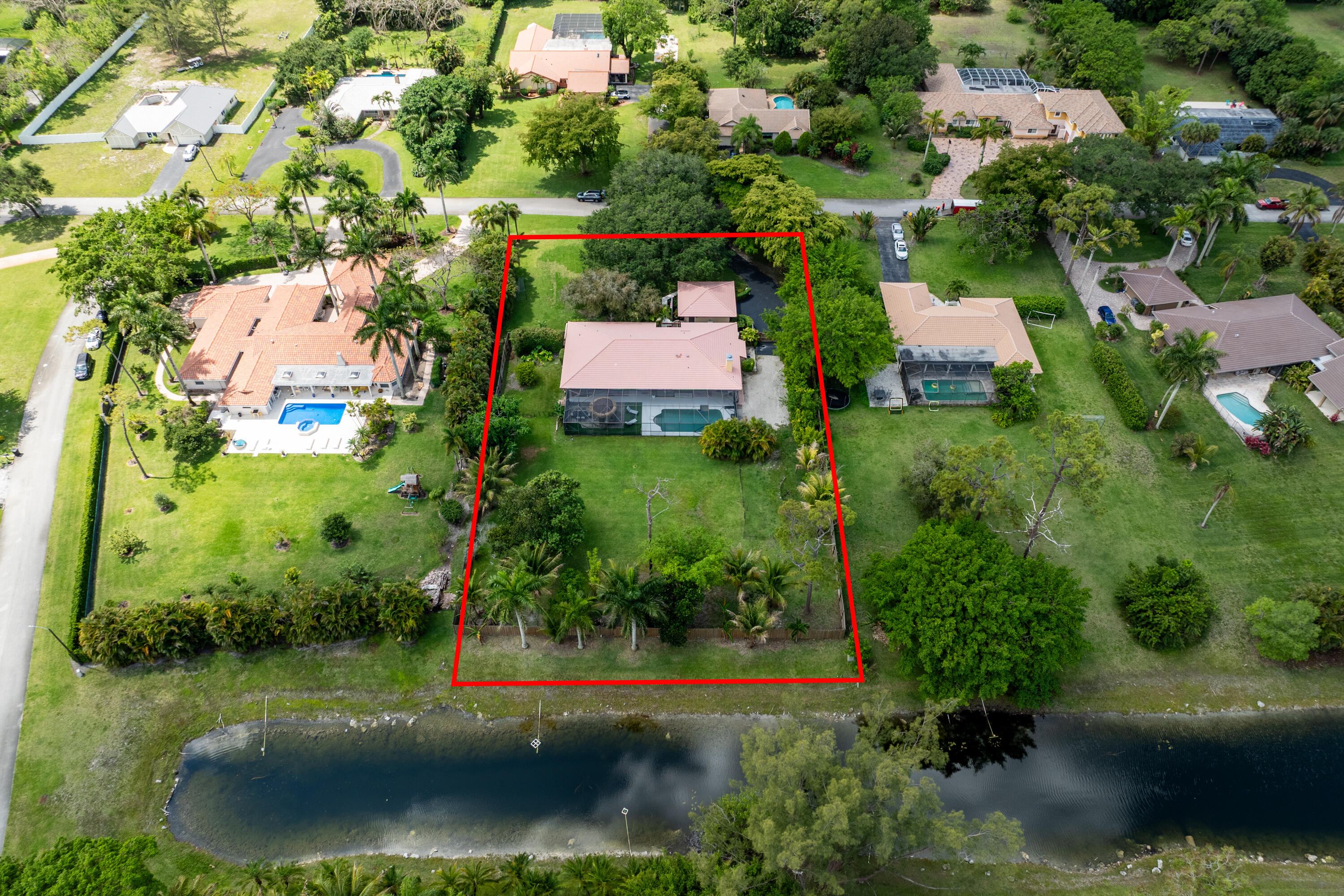 11415 Sundance Lane Boca Raton, FL 33428 - Photo 2 of 65 an aerial view of a house with a yard and lake view