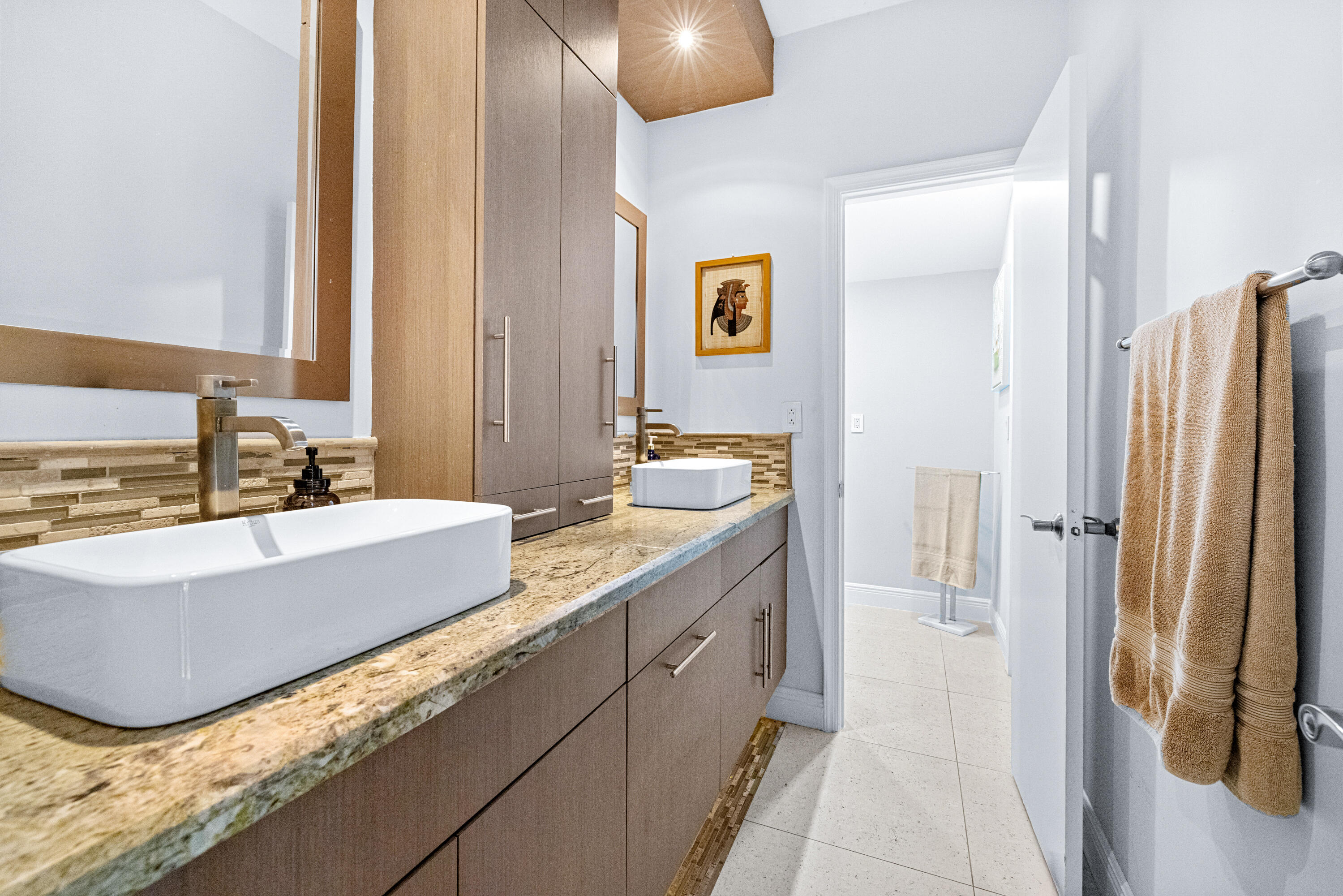 11415 Sundance Lane Boca Raton, FL 33428 - Photo 25 of 65 a bathroom with a tub sink and mirror