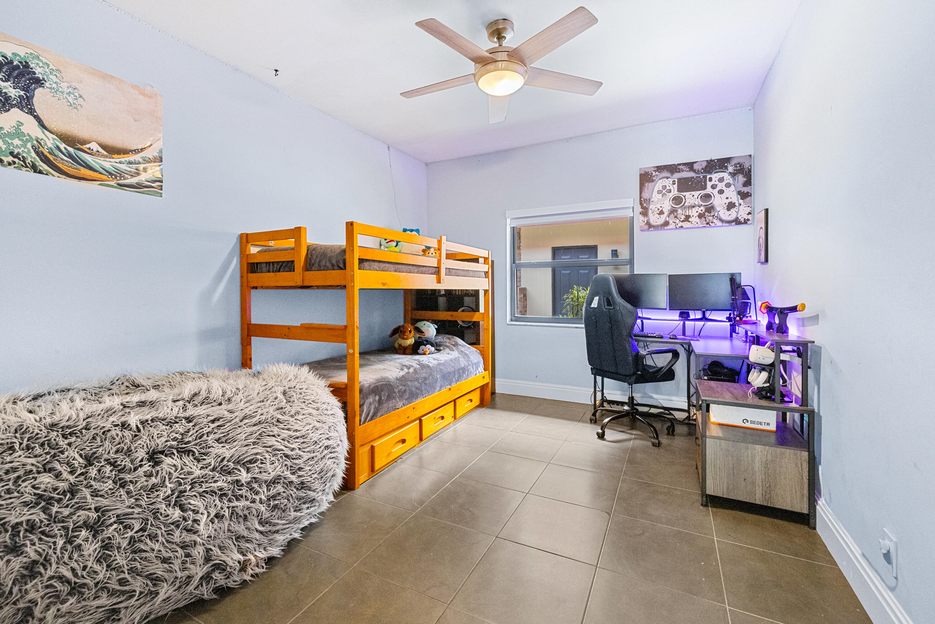 11415 Sundance Lane Boca Raton, FL 33428 - Photo 27 of 65 a bedroom with a bed and a chandelier