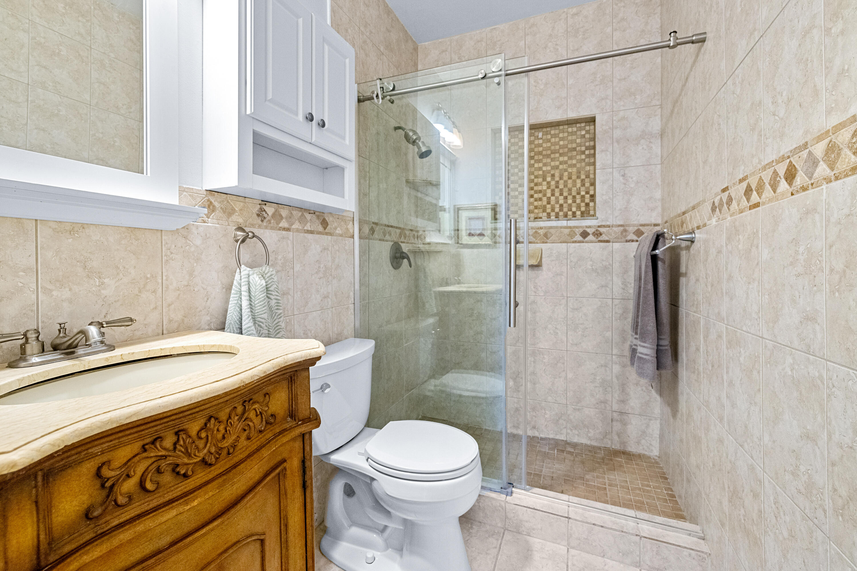 11415 Sundance Lane Boca Raton, FL 33428 - Photo 29 of 65 a bathroom with a sink a toilet and shower
