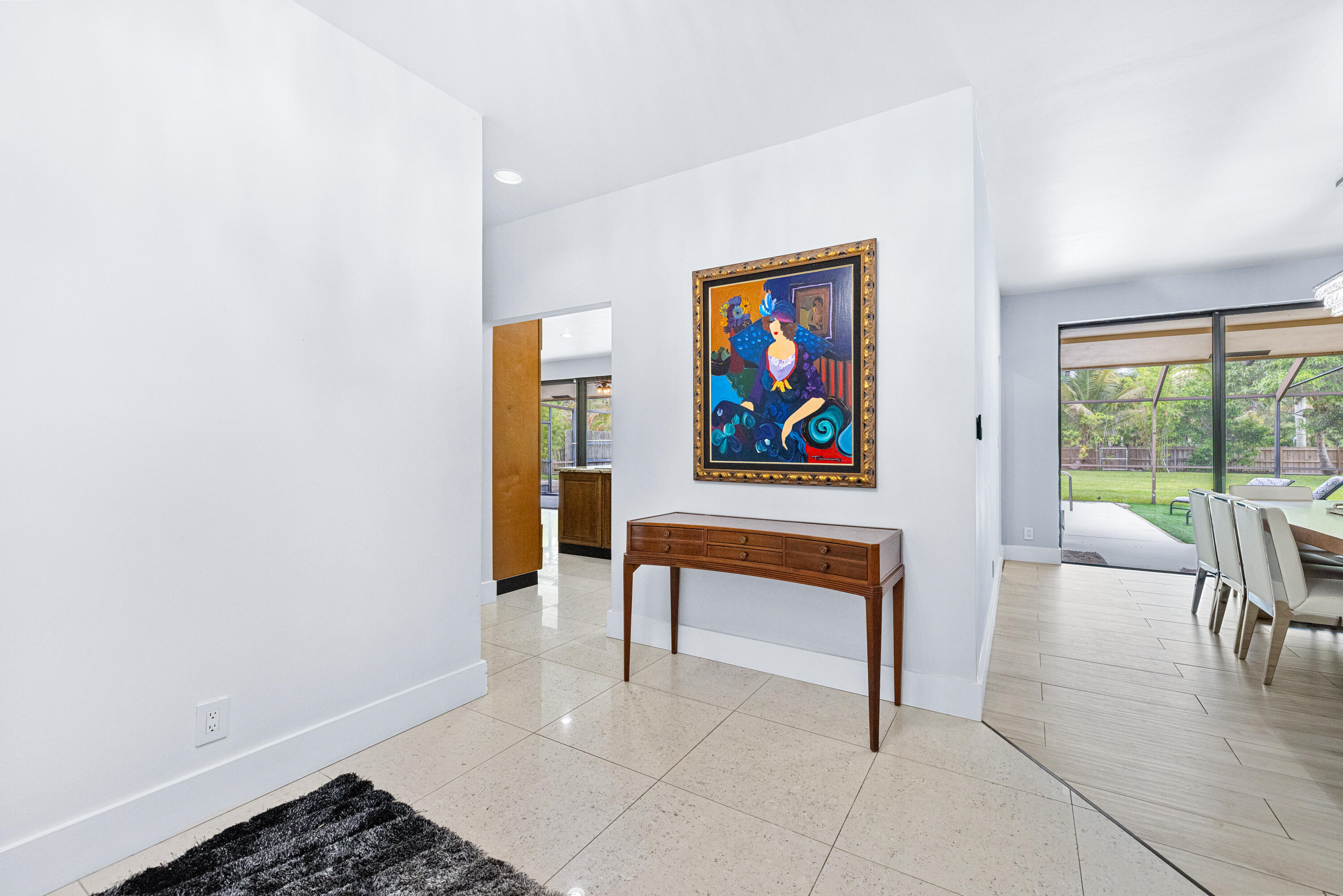 11415 Sundance Lane Boca Raton, FL 33428 - Photo 33 of 65 a living room with furniture a flat screen tv and a wall painting