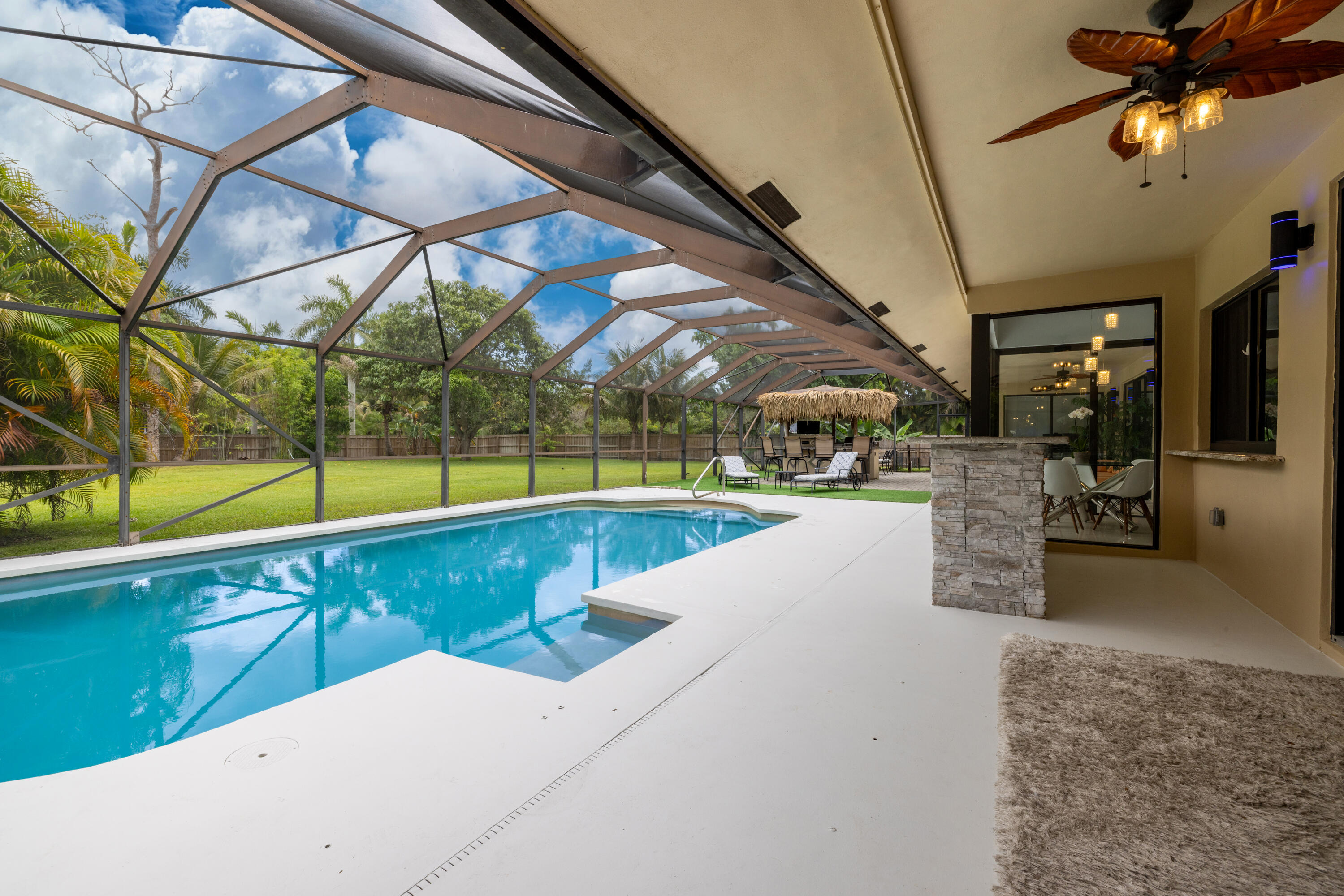 11415 Sundance Lane Boca Raton, FL 33428 - Photo 37 of 65 a view of a swimming pool with a patio and yard