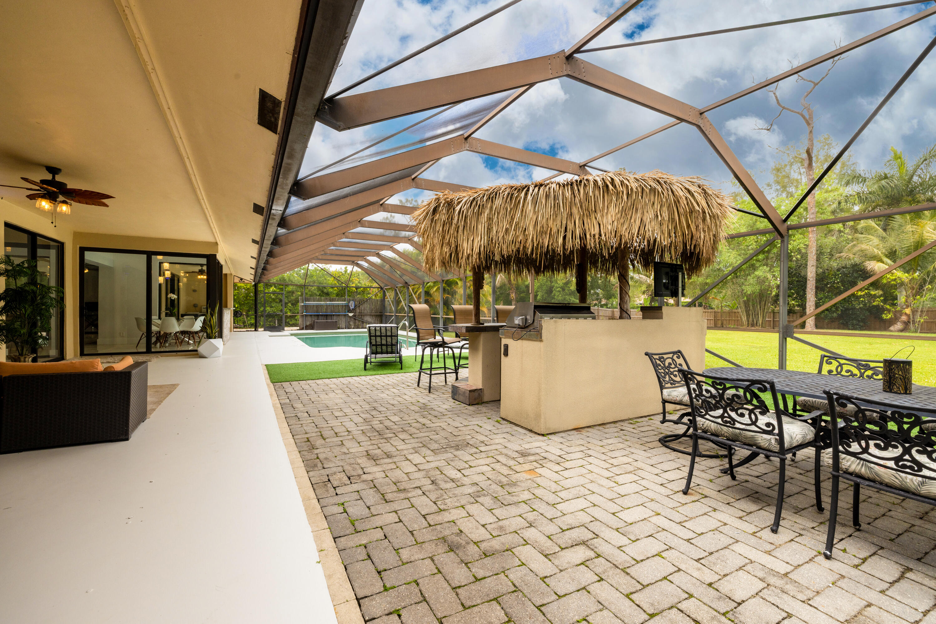 11415 Sundance Lane Boca Raton, FL 33428 - Photo 38 of 65 a view of a swimming pool with a patio
