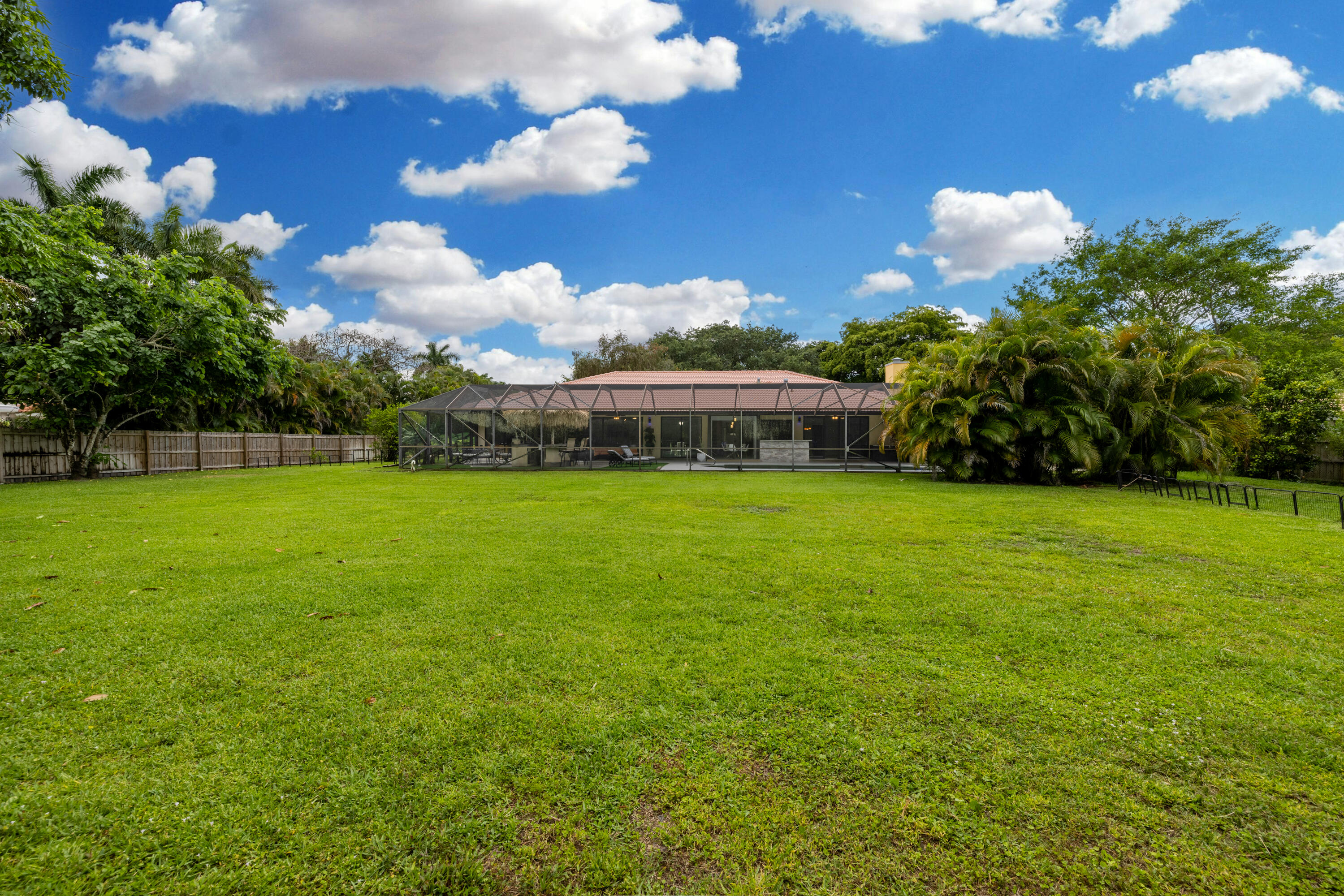 11415 Sundance Lane Boca Raton, FL 33428 - Photo 47 of 65 a view of a house with a yard and a garden
