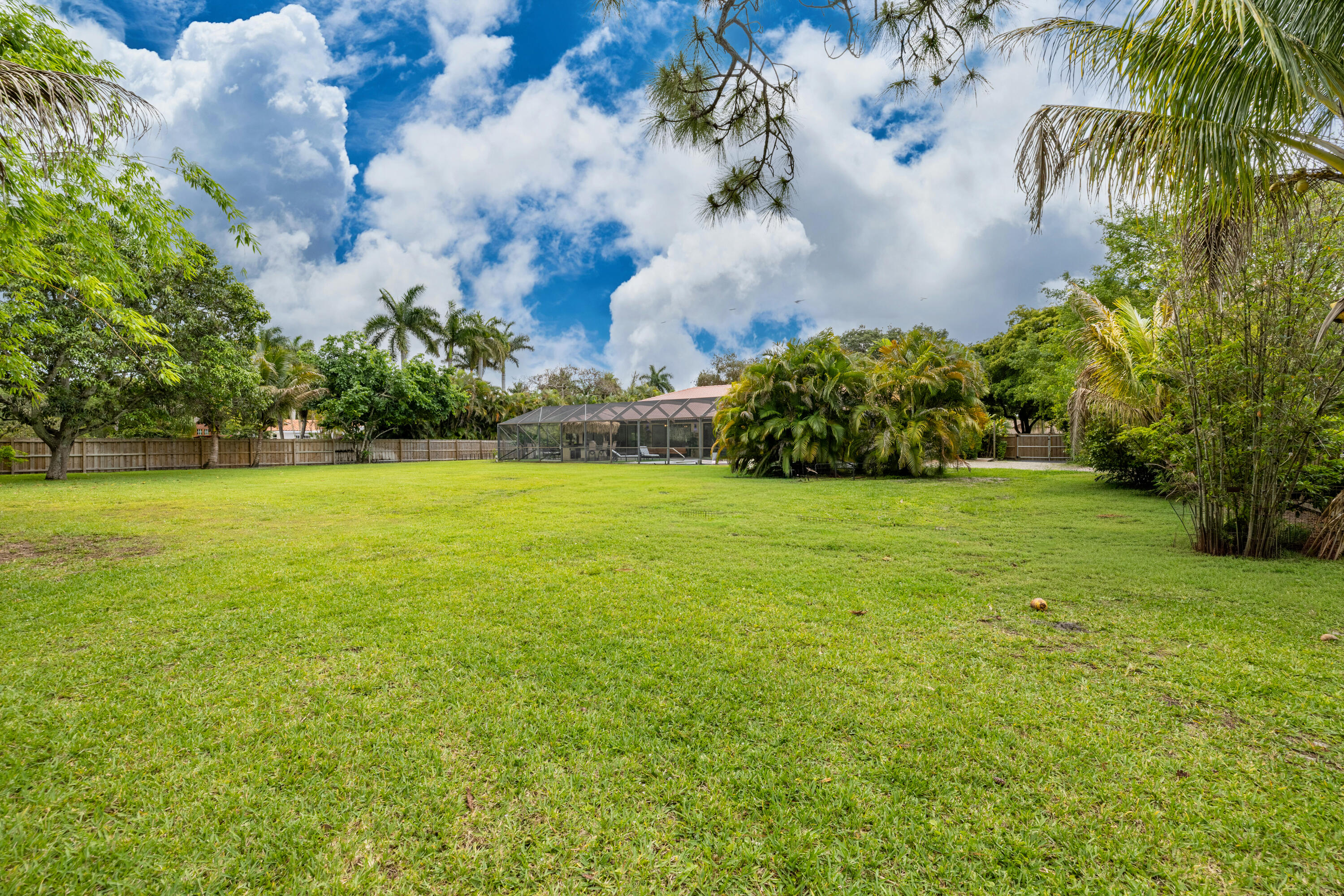 11415 Sundance Lane Boca Raton, FL 33428 - Photo 49 of 65 a view of a garden with a building in the background