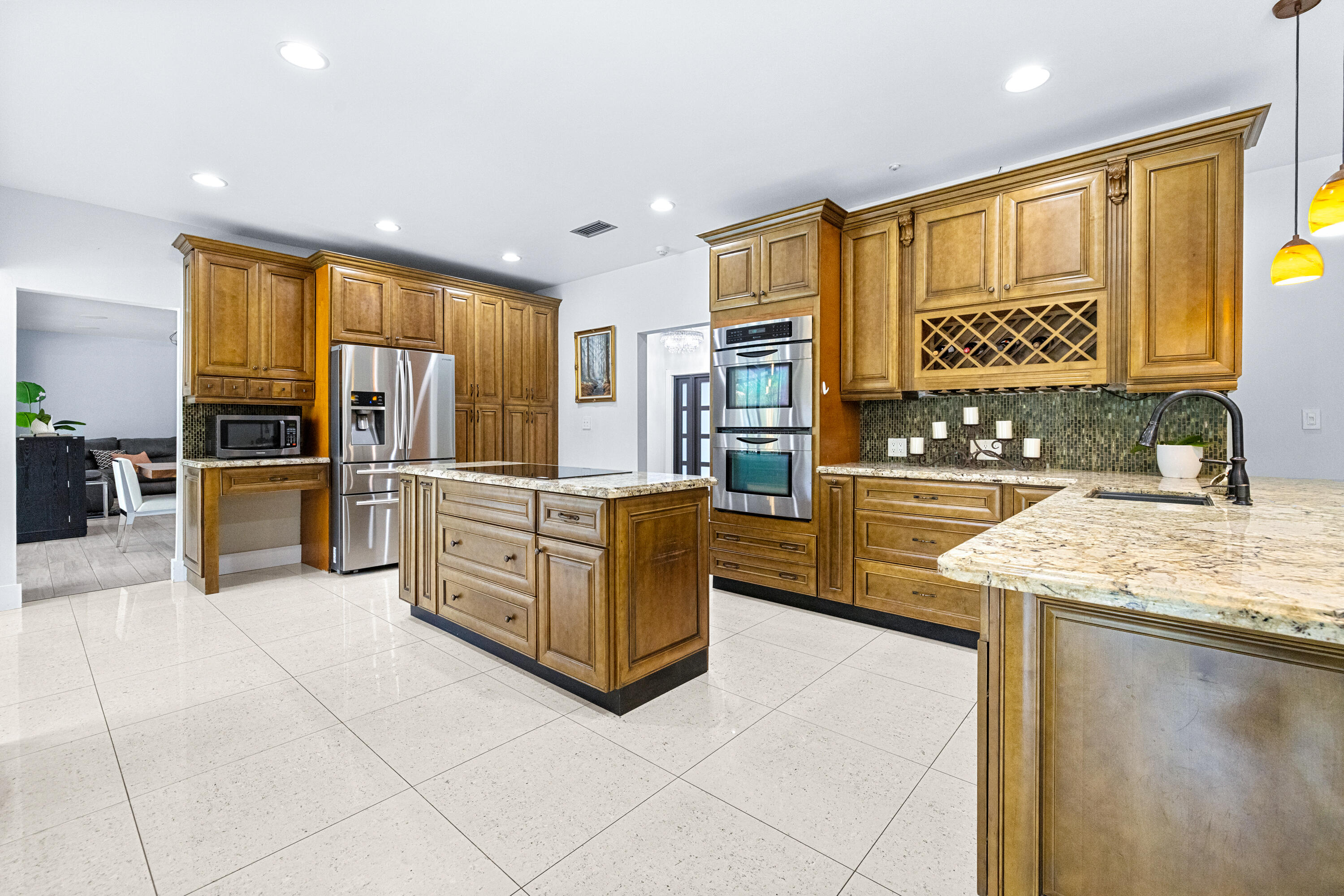 11415 Sundance Lane Boca Raton, FL 33428 - Photo 9 of 65 a kitchen with stainless steel appliances granite countertop a sink and cabinets