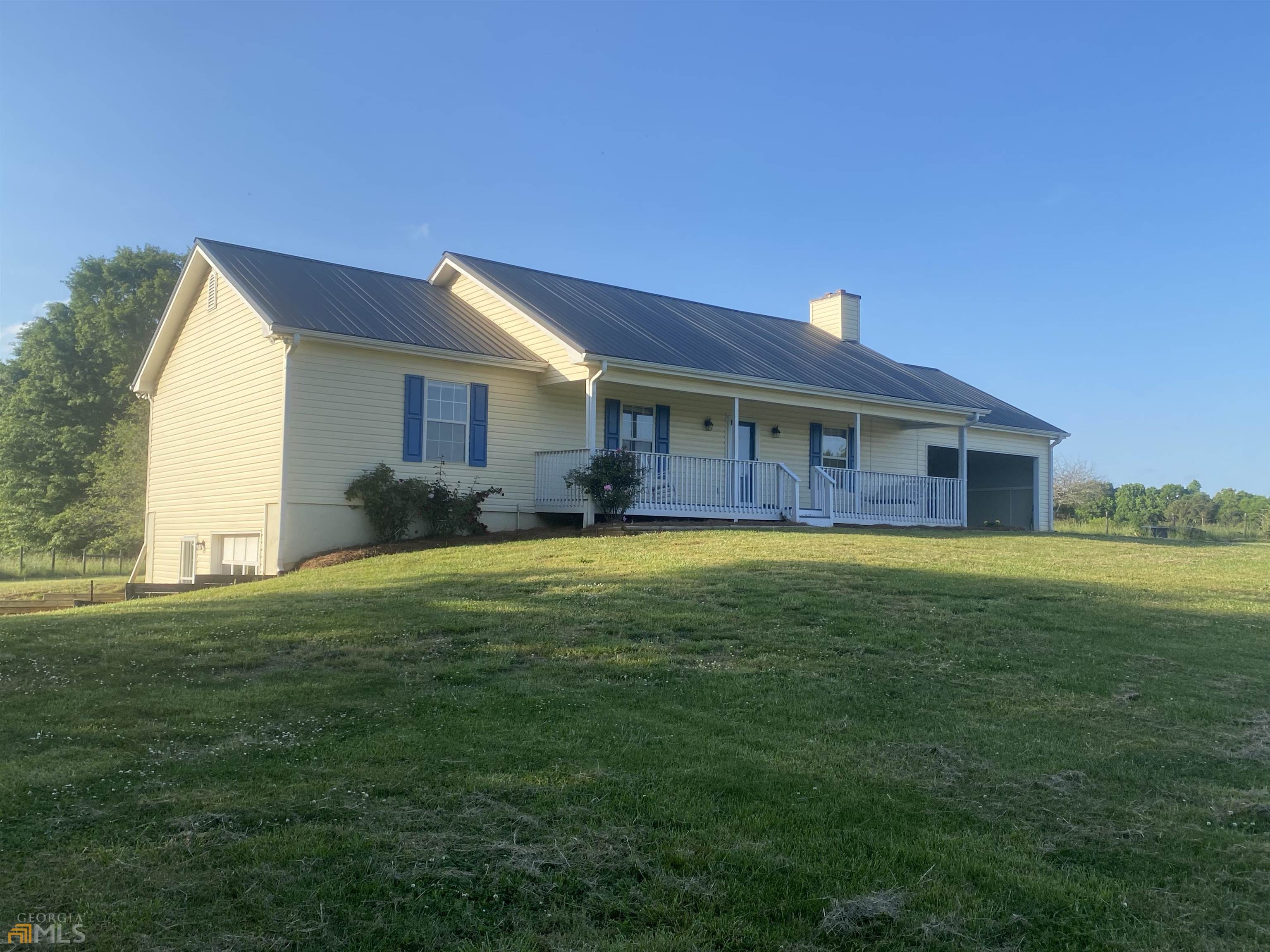 3495 Glass Road Monroe, GA 30656 - Photo 1 of 1 a front view of a house with a garden