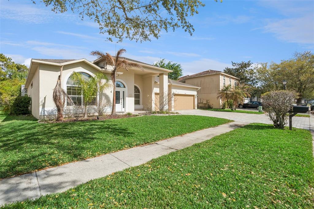 2541 Teton Stone Run Orlando, FL 32828 - Photo 18 of 82 a front view of house with yard and green space