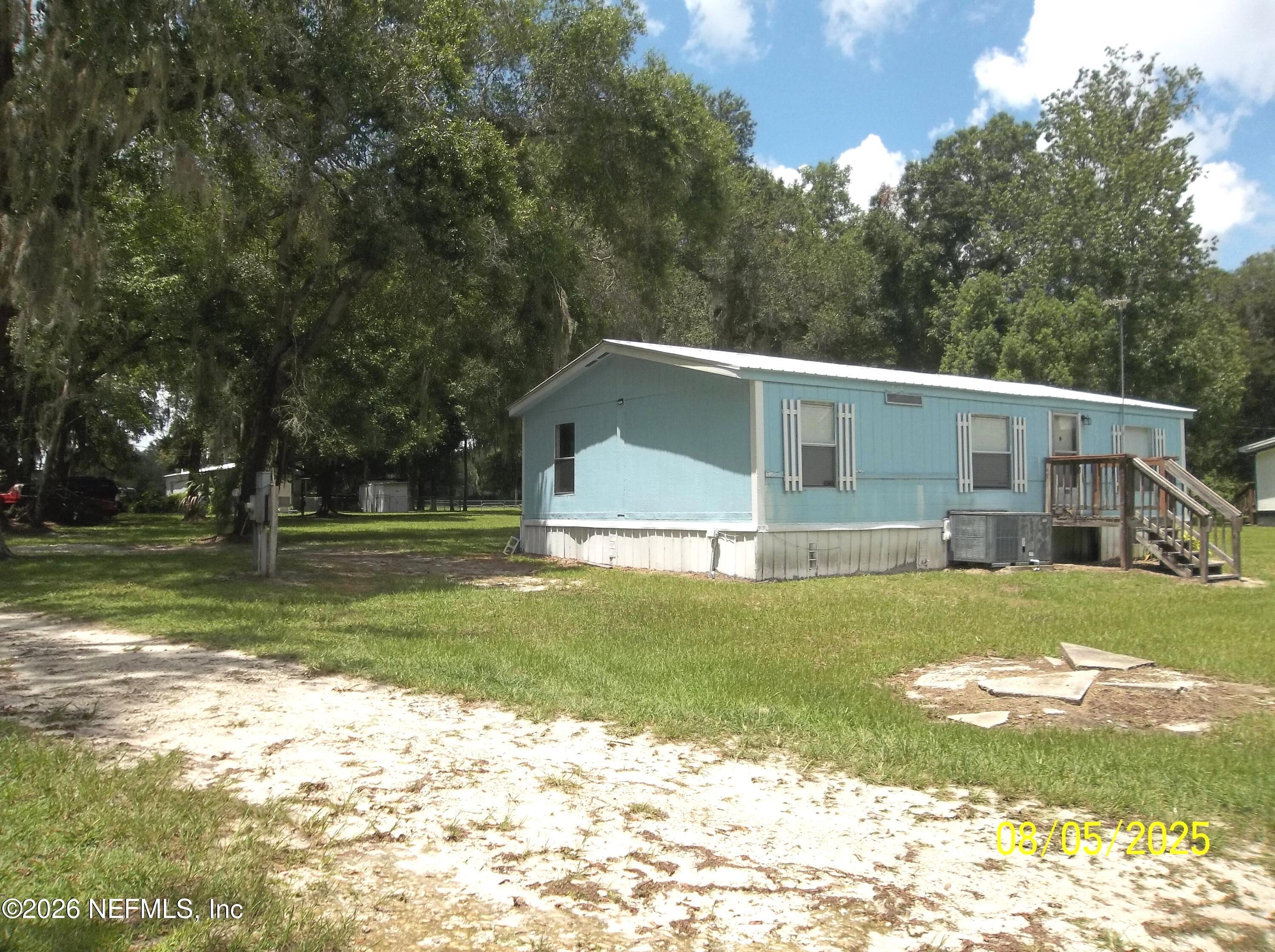 131 Pomona Landing Road Pomona Park, FL 32112 - Photo 11 of 19 a view of a house with a yard