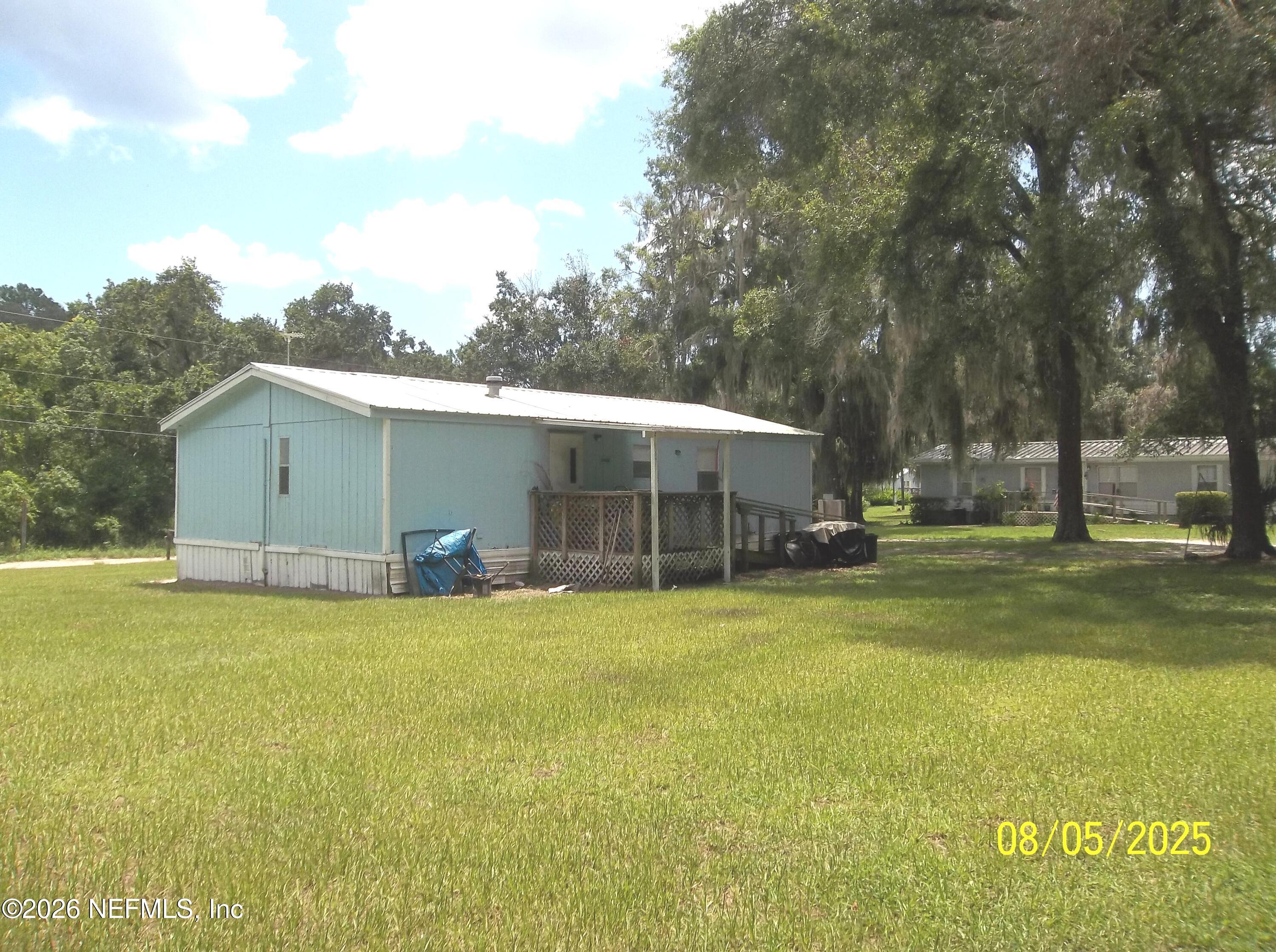 131 Pomona Landing Road Pomona Park, FL 32112 - Photo 12 of 19 a view of a house with a yard and sitting area