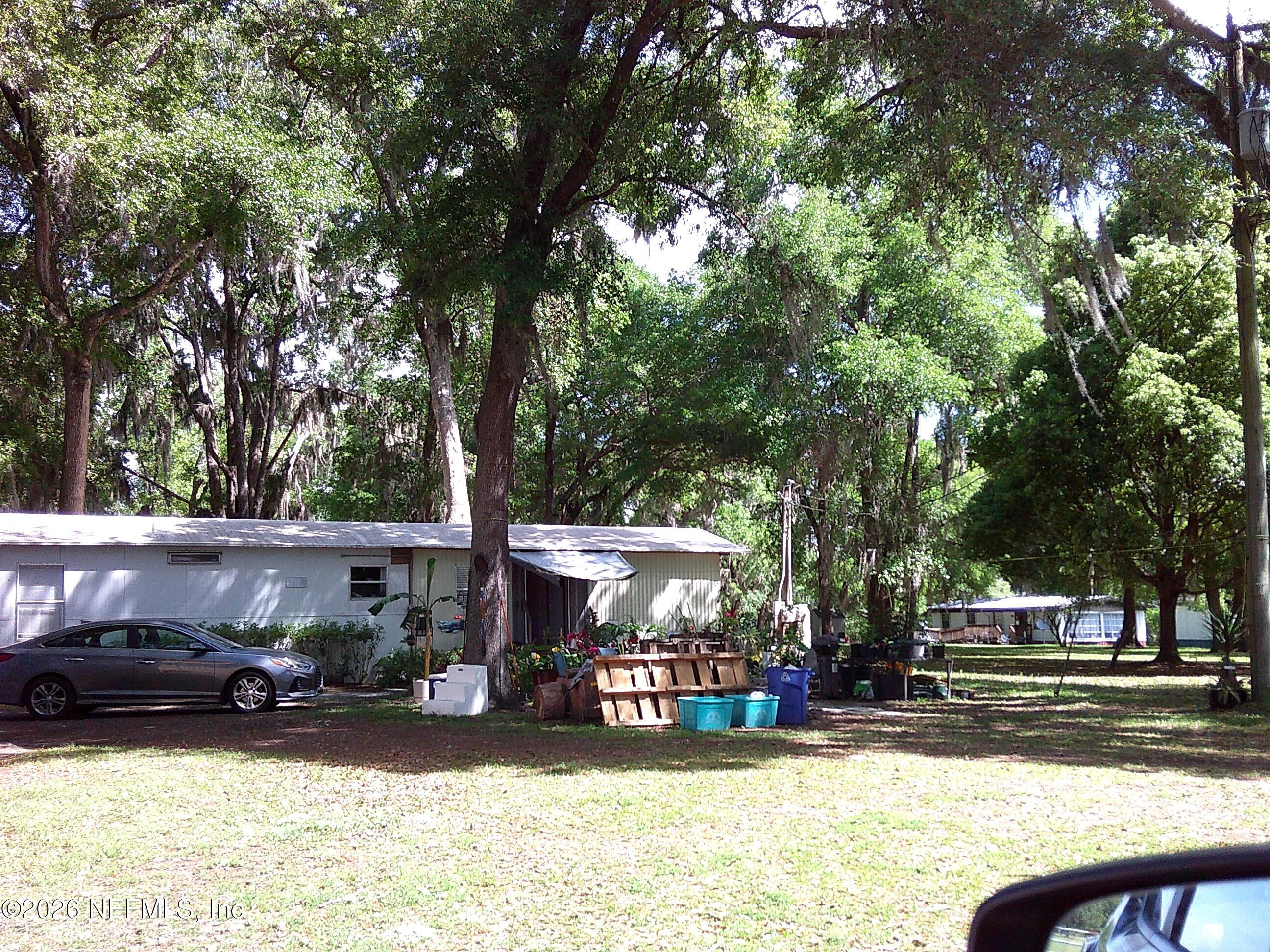 131 Pomona Landing Road Pomona Park, FL 32112 - Photo 13 of 19 a view of a house with a yard