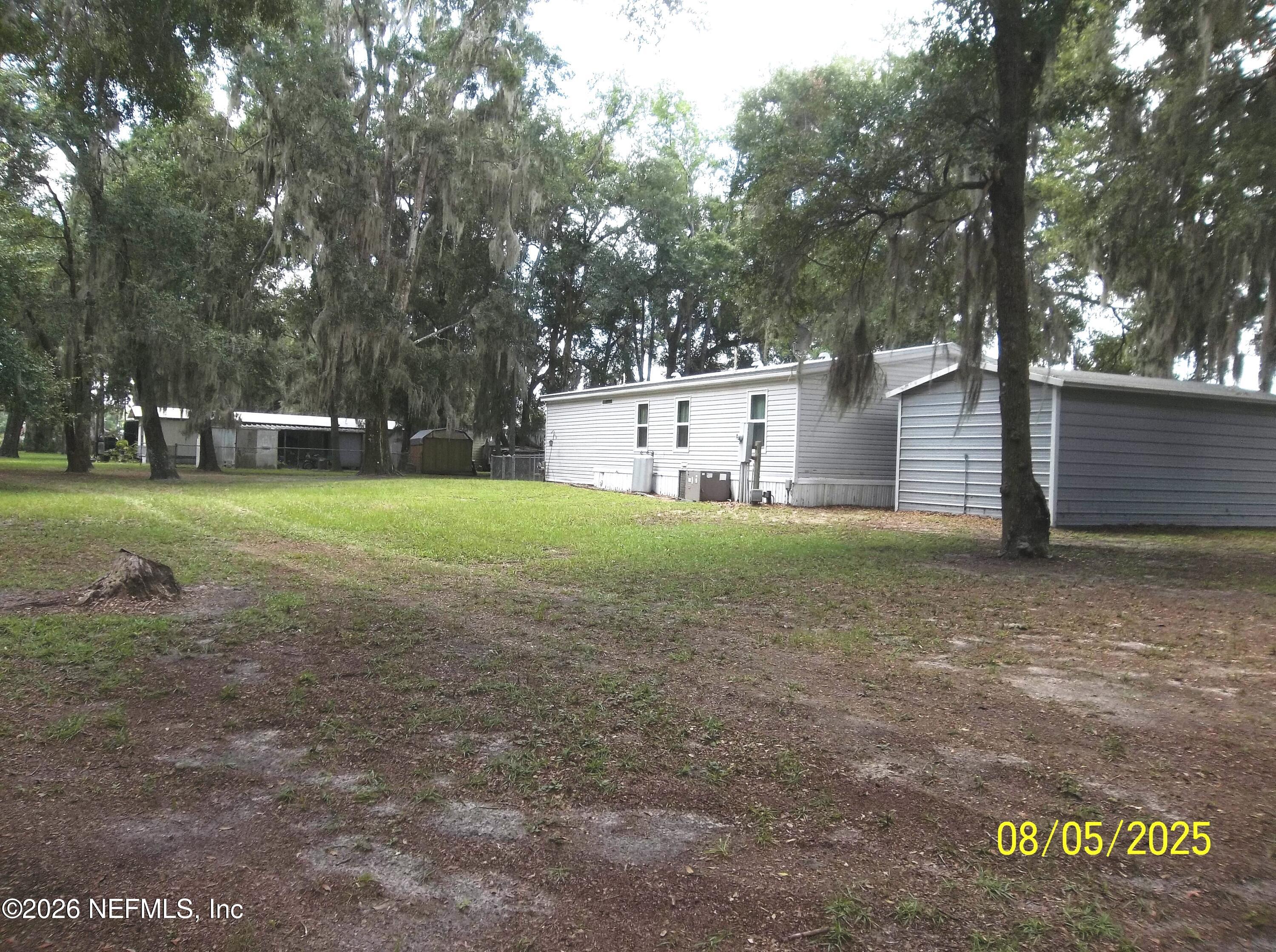131 Pomona Landing Road Pomona Park, FL 32112 - Photo 3 of 19 a view of a house with a yard