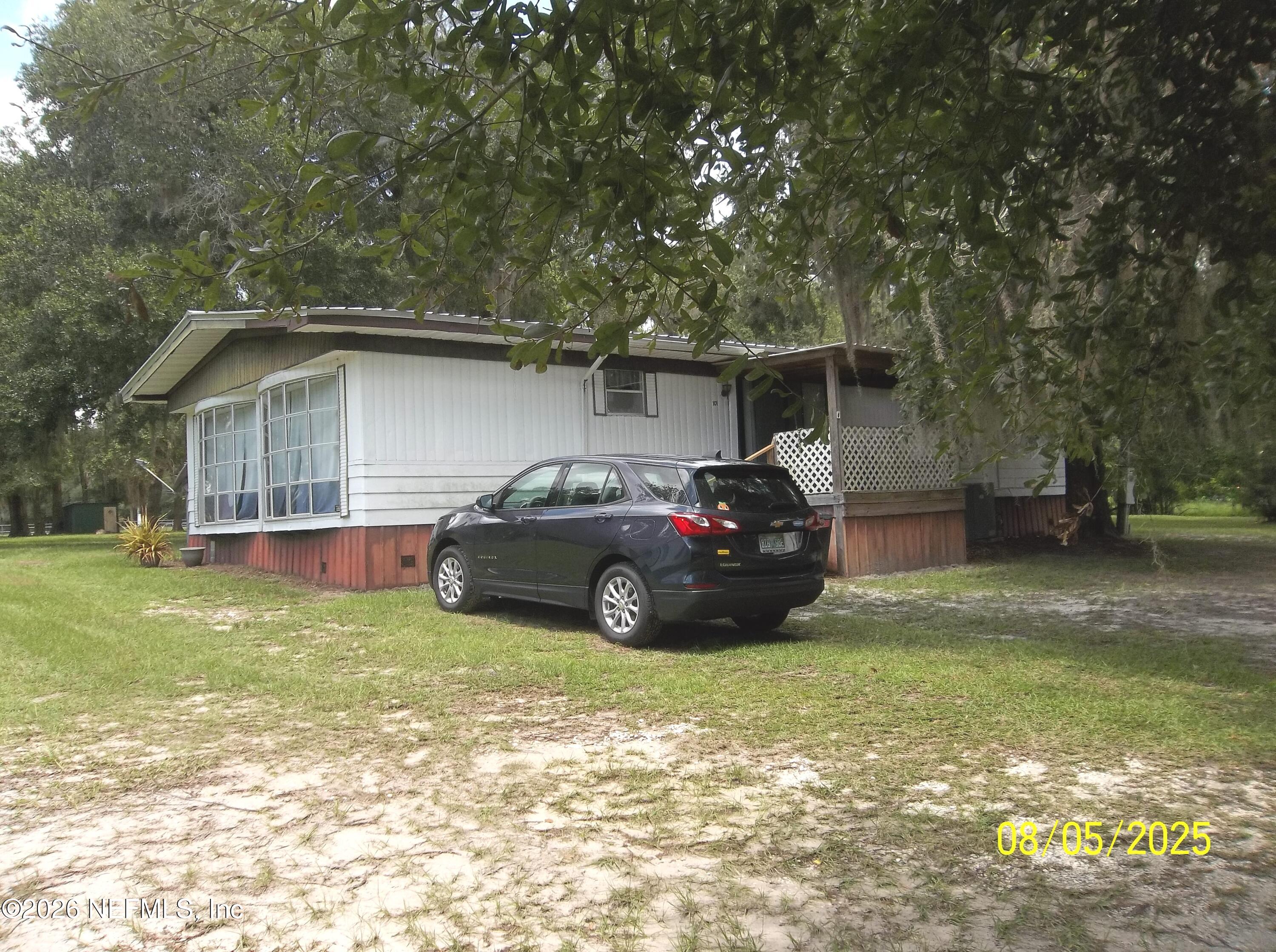 131 Pomona Landing Road Pomona Park, FL 32112 - Photo 6 of 19 a view of a car in front of house