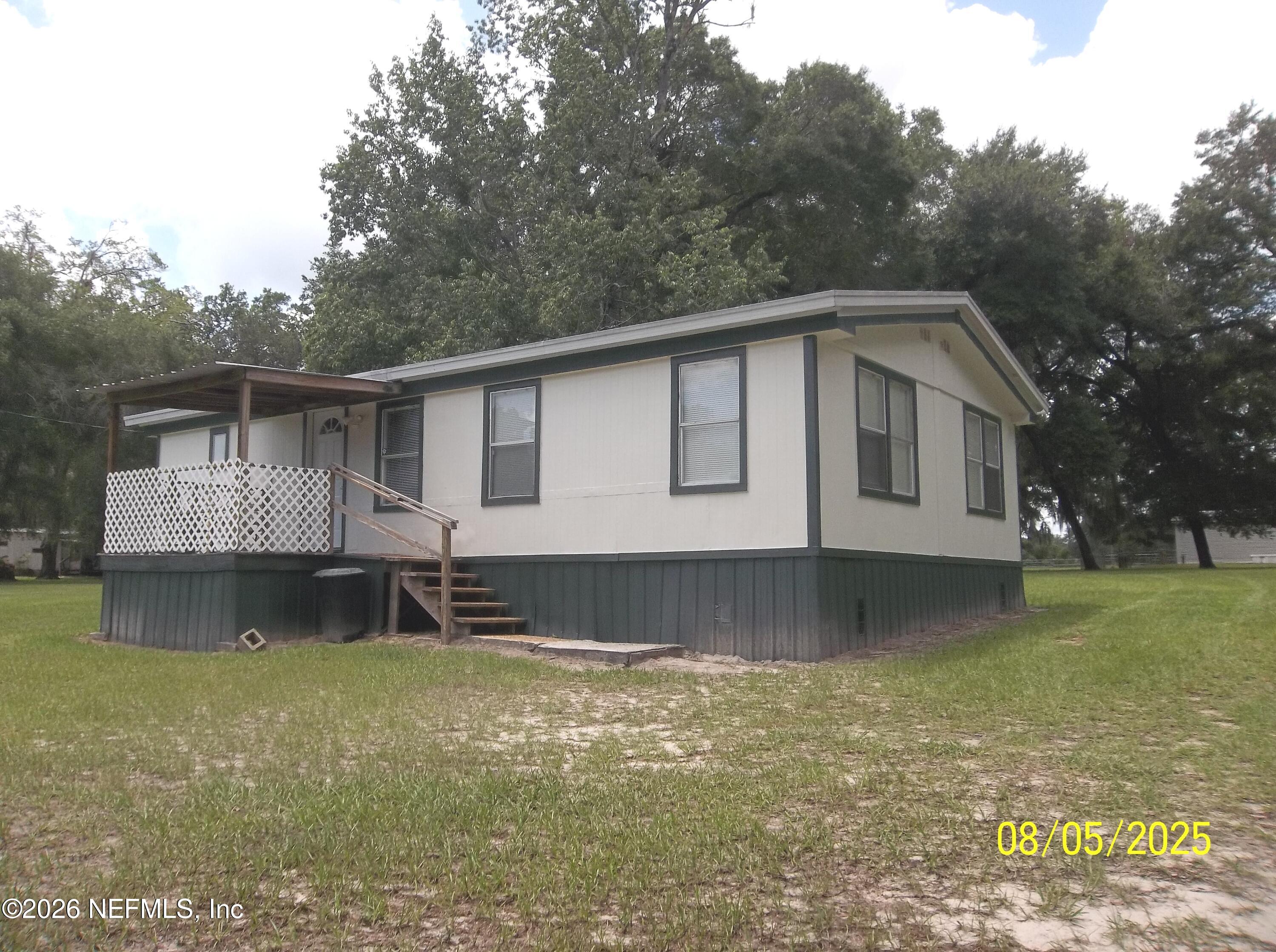 131 Pomona Landing Road Pomona Park, FL 32112 - Photo 8 of 19 a front view of a house with garden