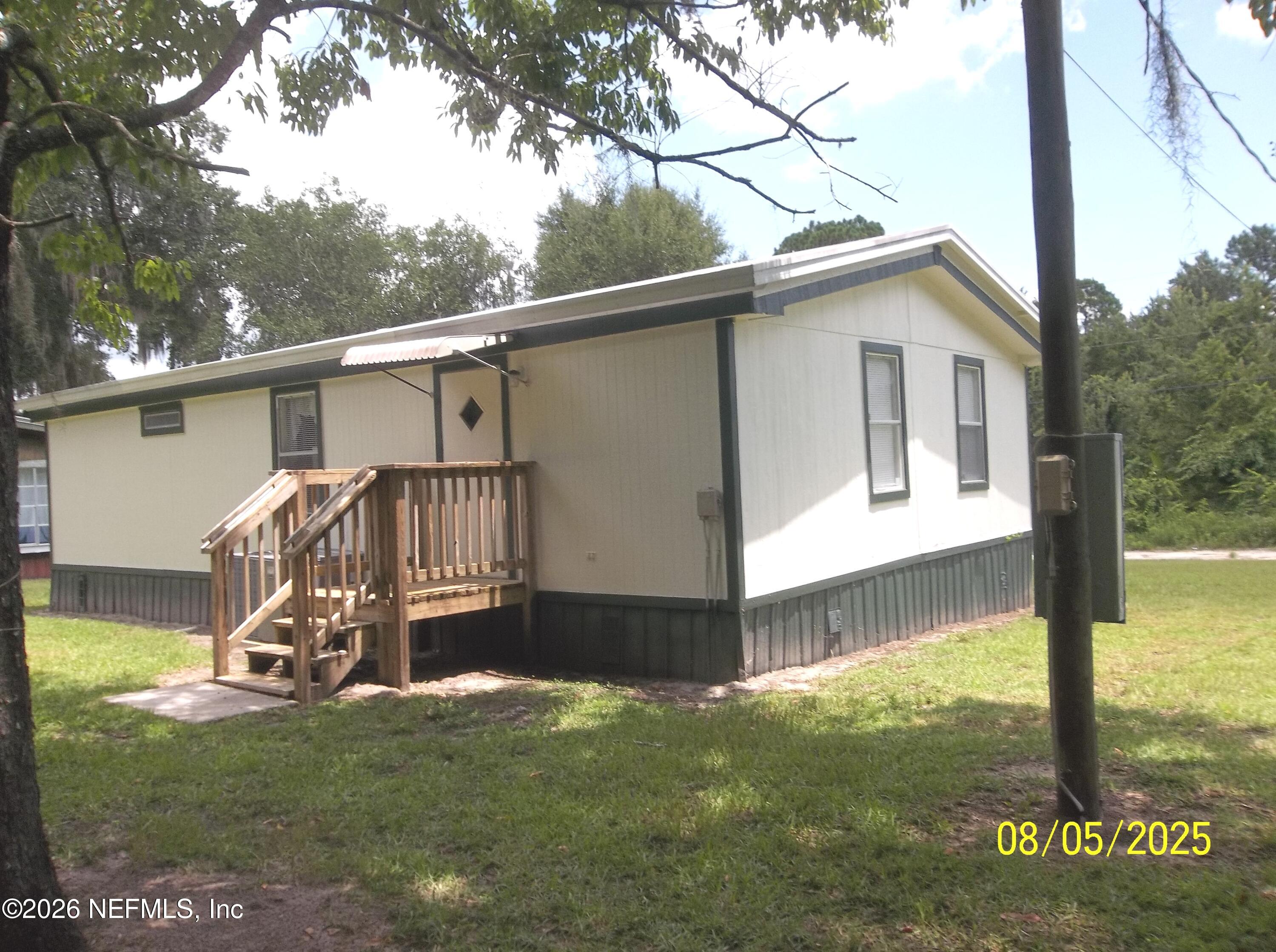 131 Pomona Landing Road Pomona Park, FL 32112 - Photo 9 of 19 a view of a small house with a yard