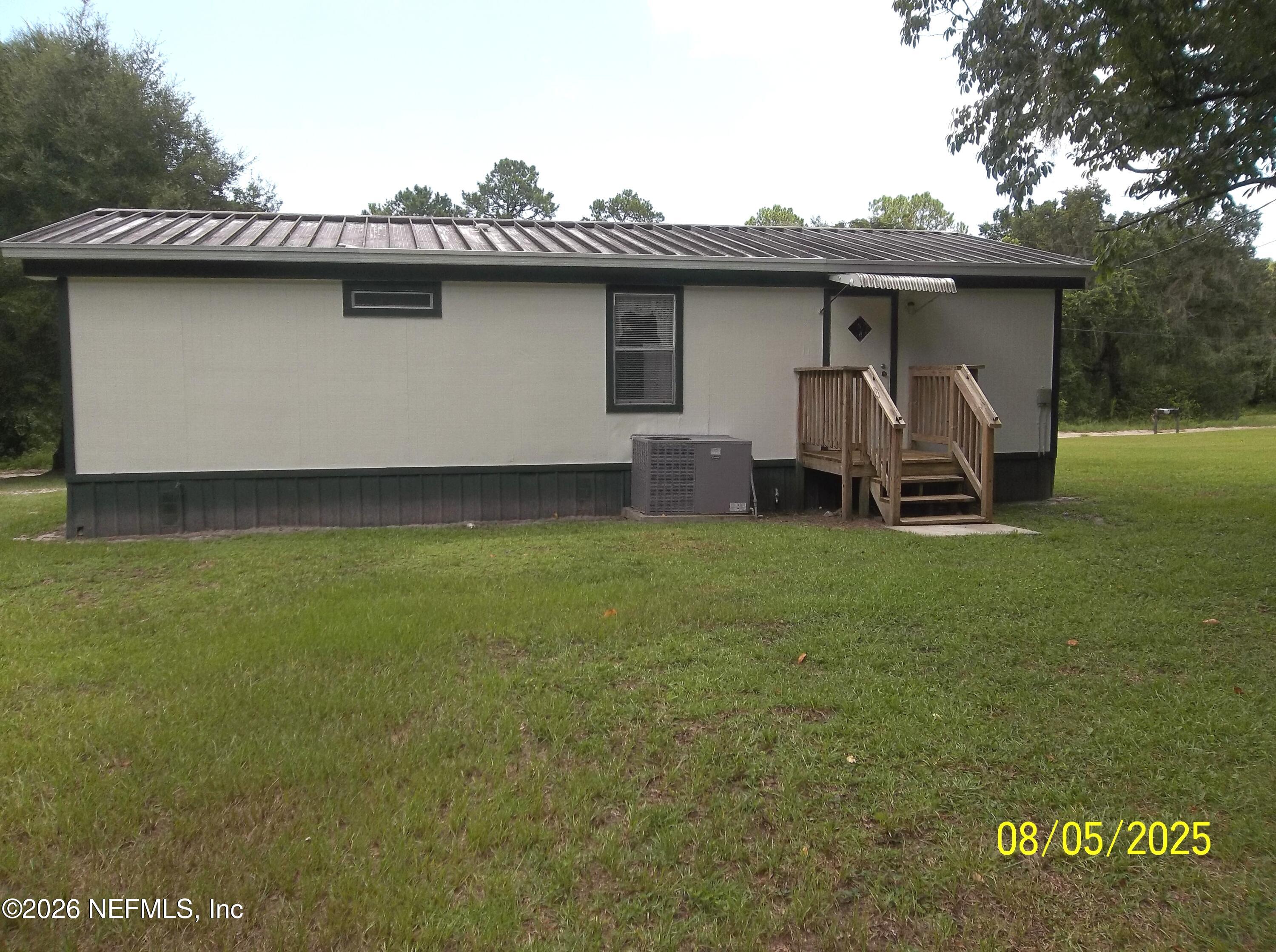 131 Pomona Landing Road Pomona Park, FL 32112 - Photo 10 of 19 a front view of a house with garden