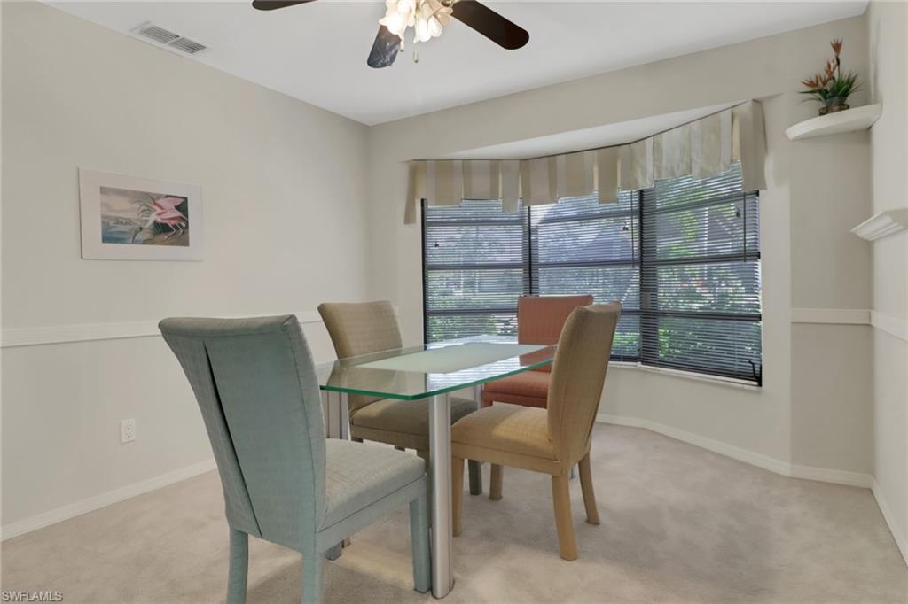 4961 Berkeley Drive Naples, FL 34112 - Photo 14 of 29 a dining room with furniture and window