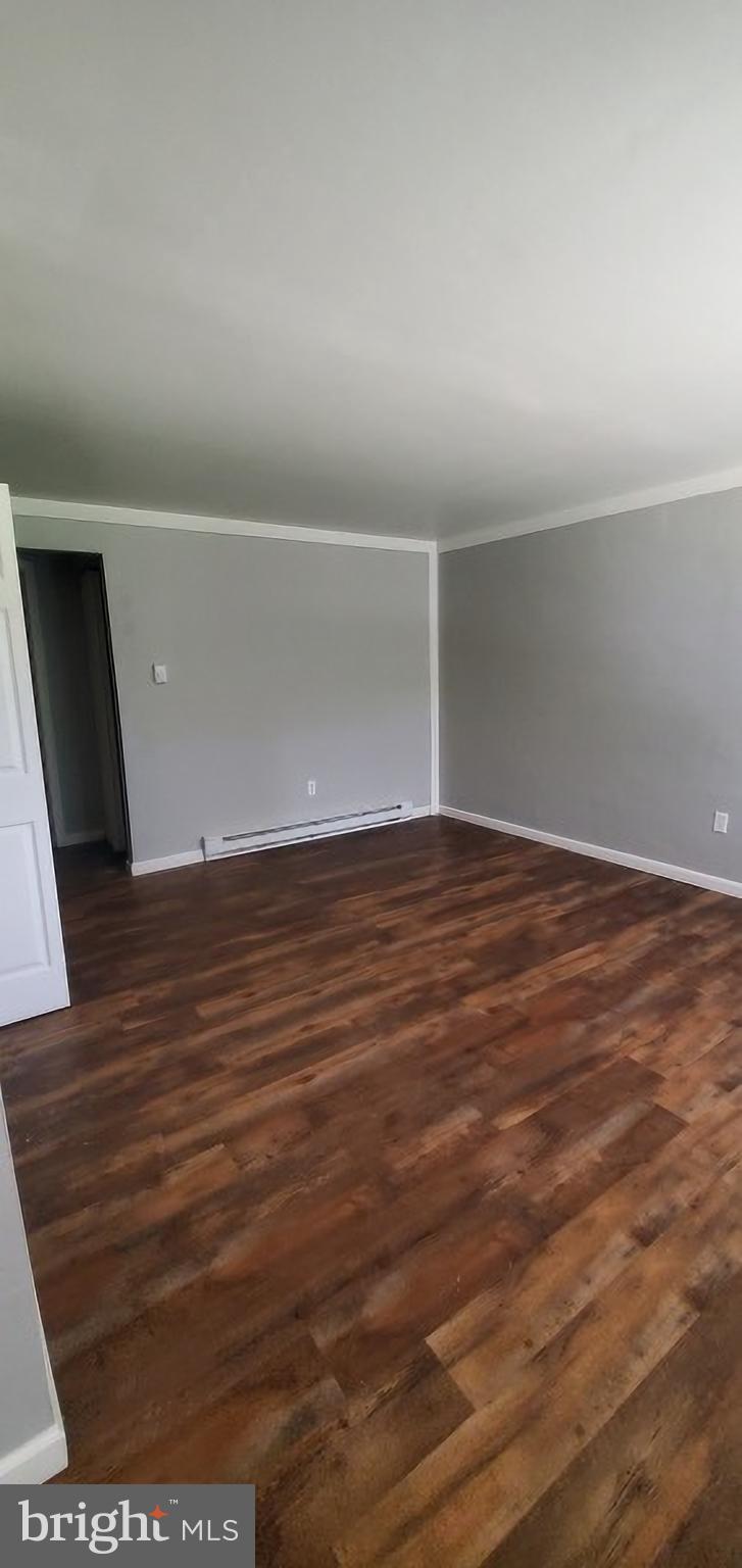 47 East Main Street, Unit E Windsor, PA 17366 - Photo 3 of 4 a view of an empty room with wooden floor