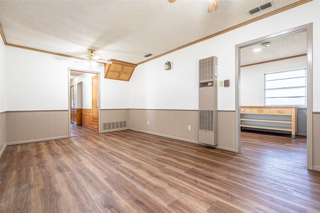 501 Endora Dublin, TX 76446 - Photo 11 of 39 a view of empty room with wooden floor and fan
