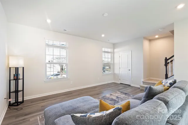 a living room with furniture and a rug