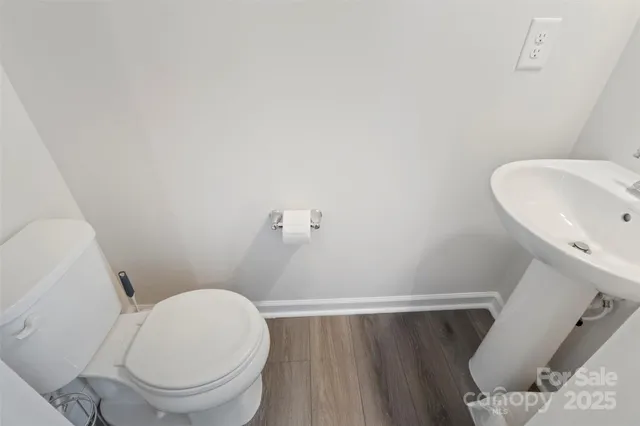 a bedroom with a bed and chair