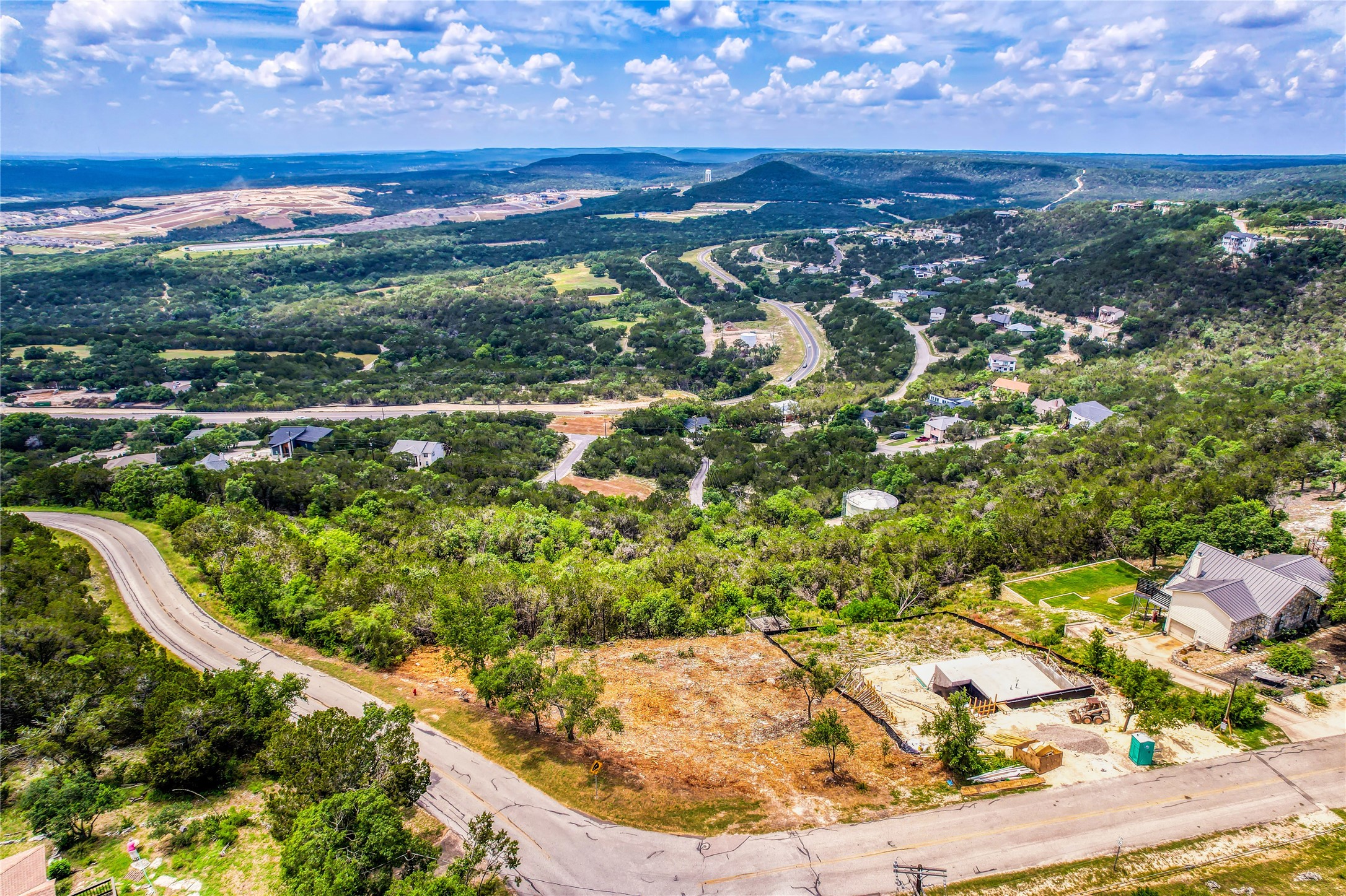 8224 Bar K Ranch Road Lago Vista, TX 78645 - Photo 5 of 25 "WOW"....Breathtaking Views!...8224 Bar-K Ranch Rd is pictured in the bottom middle of this photo. located at the corner where Bar-K Ranch Rd meets Bar-K Ranch Rd. The lot is partially cleared.