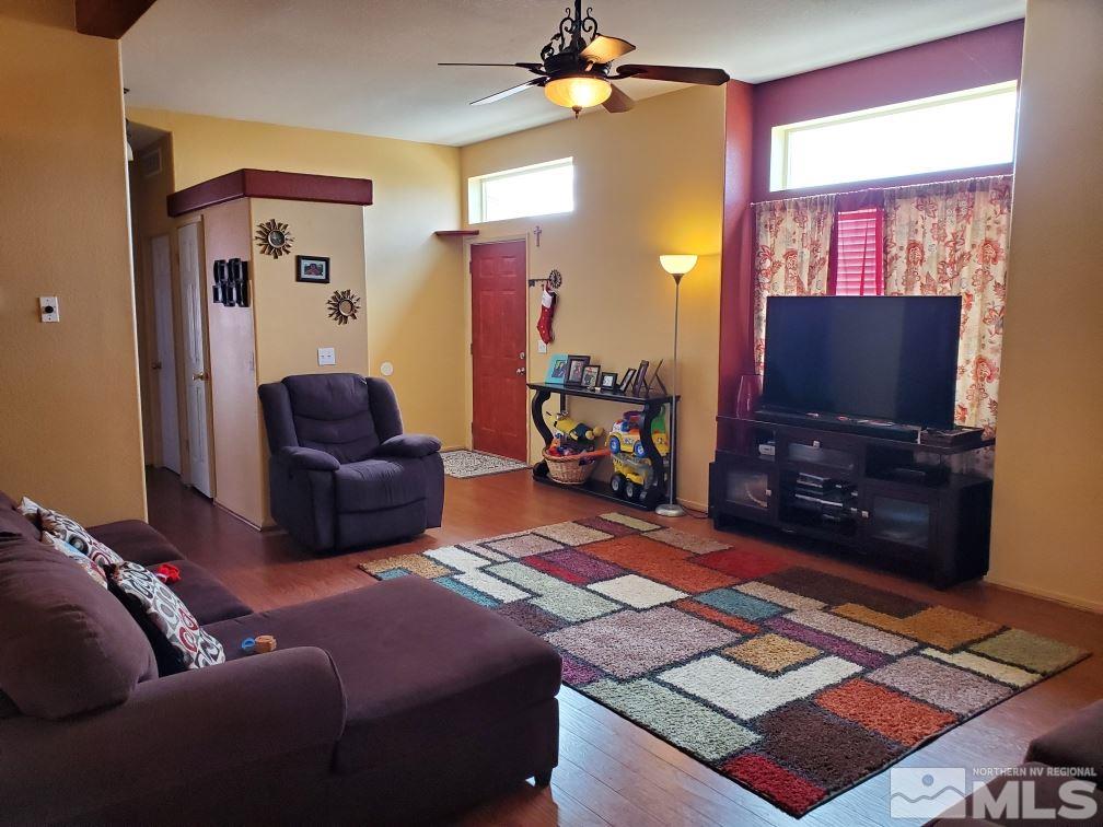 1337 Lynx Street Reno, NV 89506 - Photo 4 of 20 a living room with furniture and a flat screen tv
