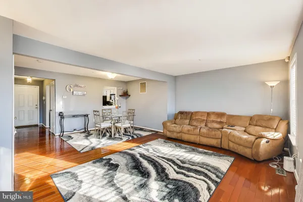 a living room with furniture and a table