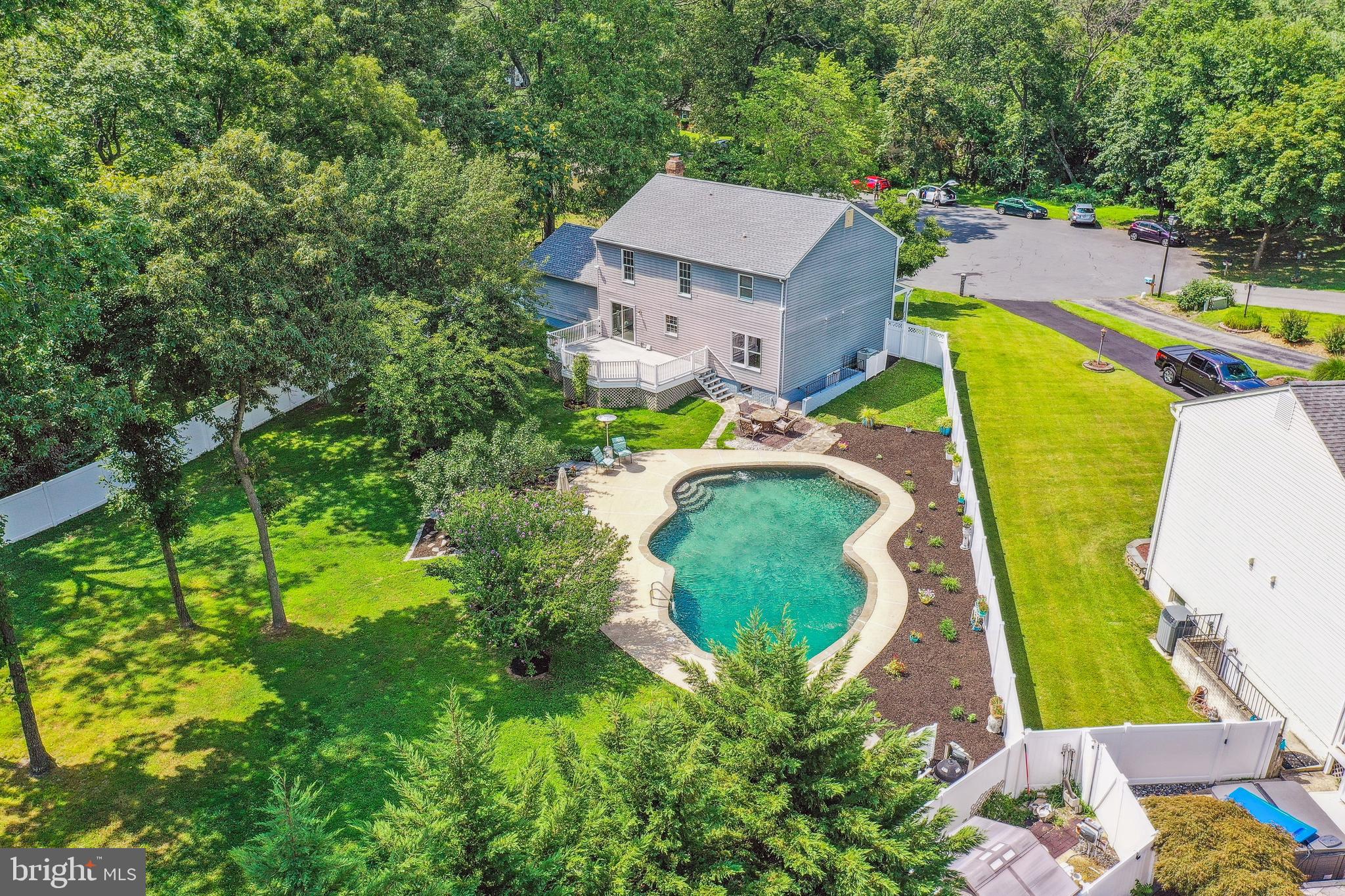 735 Evergreen Road Severn, MD 21144 - Photo 42 of 47 an aerial view of a house with swimming pool and large trees