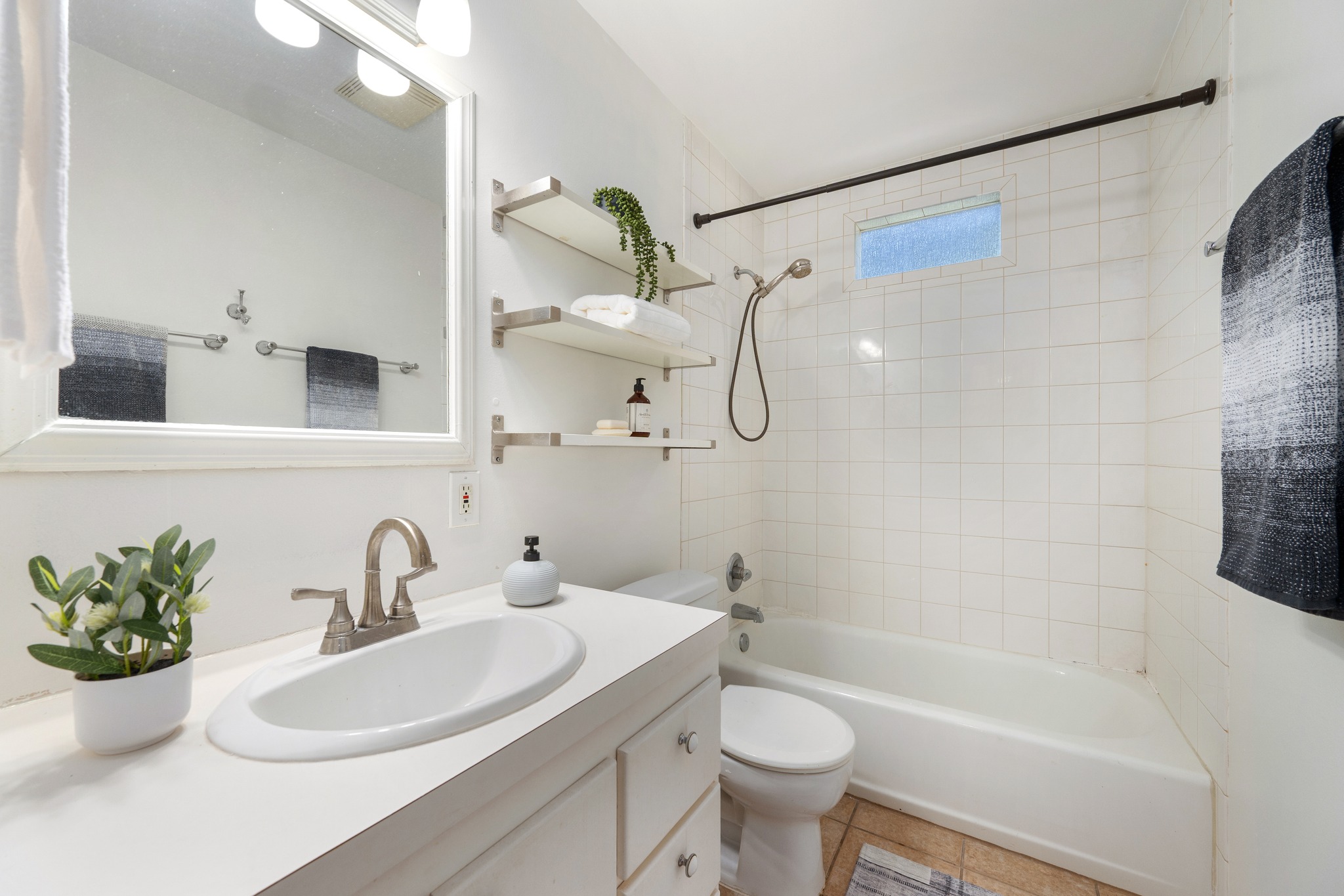 3403 Clawson Road Austin, TX 78704 - Photo 31 of 38 Unit B's full bath also offers a shower/tub combo and a quaint window for natural light.