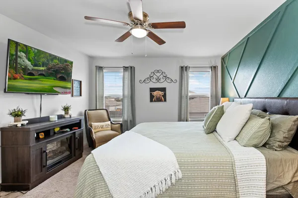 a bedroom with a bed and a window