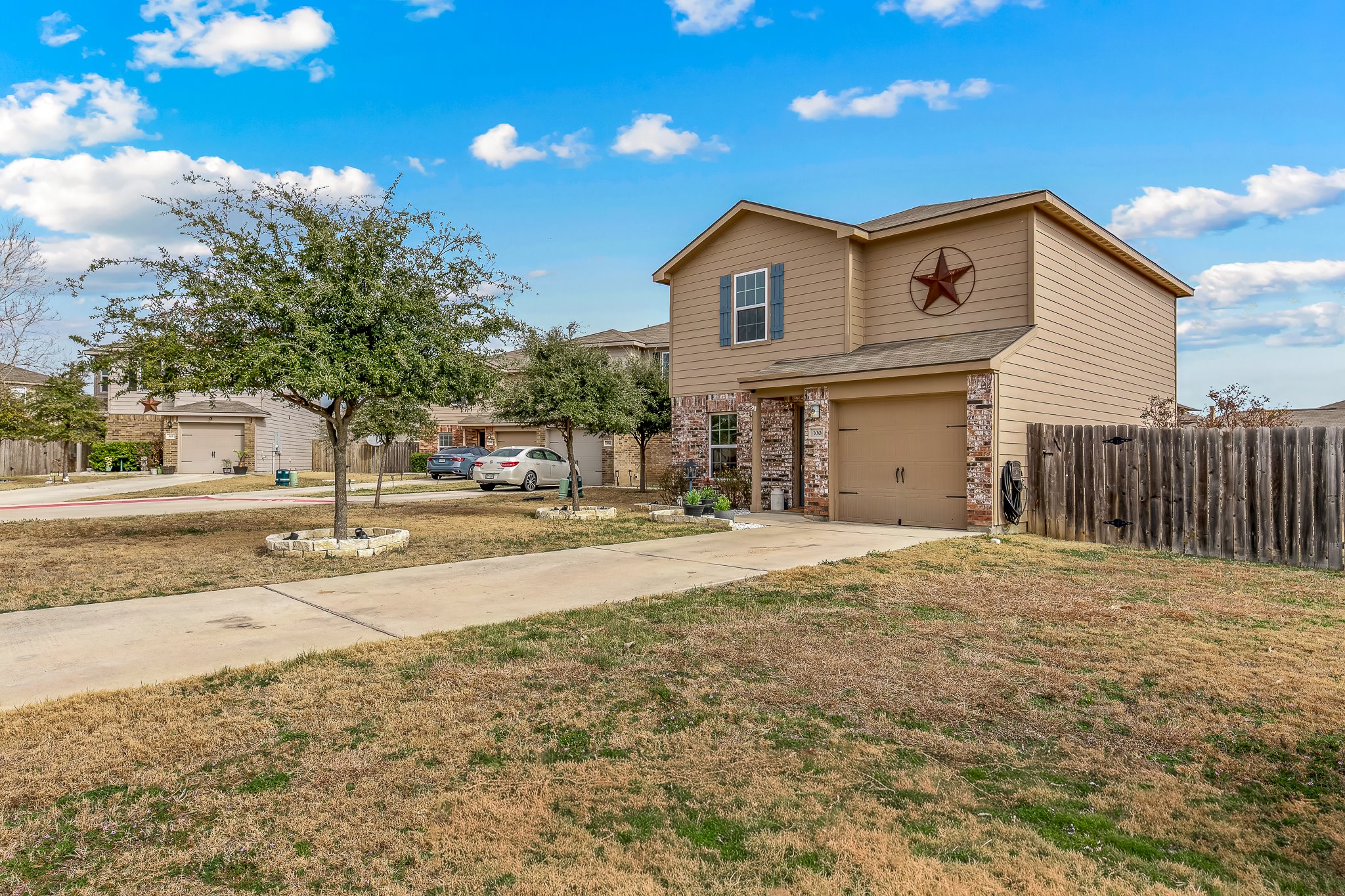 100 Wincliff Cove, Unit 13D Jarrell, TX 76537 - Photo 2 of 40 a view of a house with a yard and road