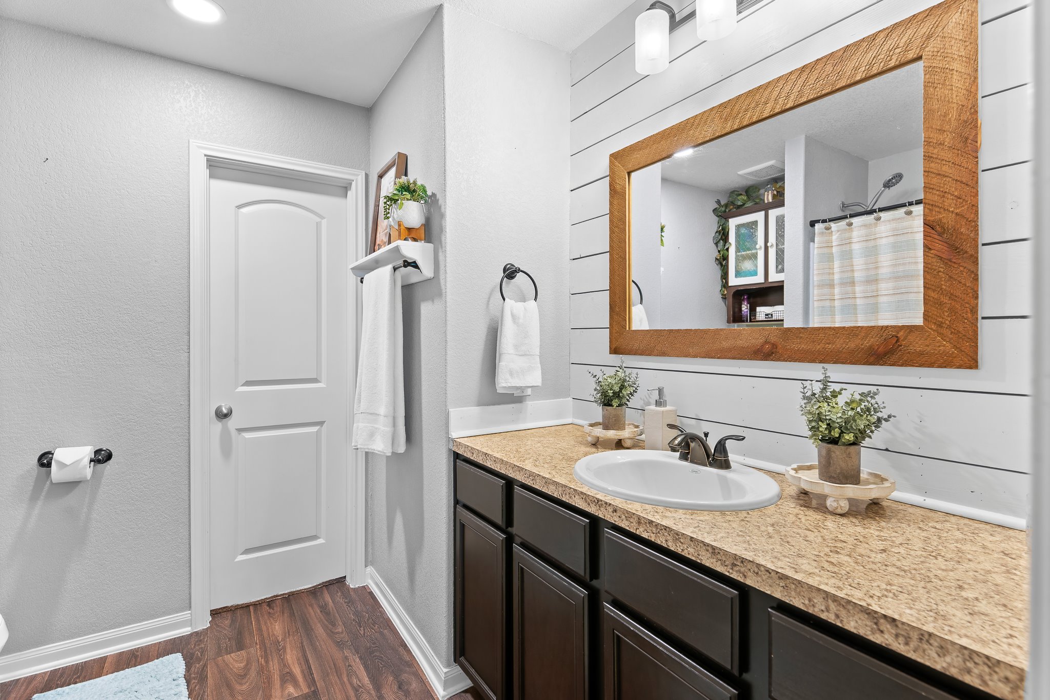 100 Wincliff Cove, Unit 13D Jarrell, TX 76537 - Photo 22 of 40 a bathroom with a granite countertop sink and a mirror