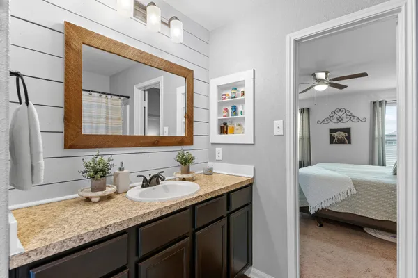 a front view of a house with potted plants
