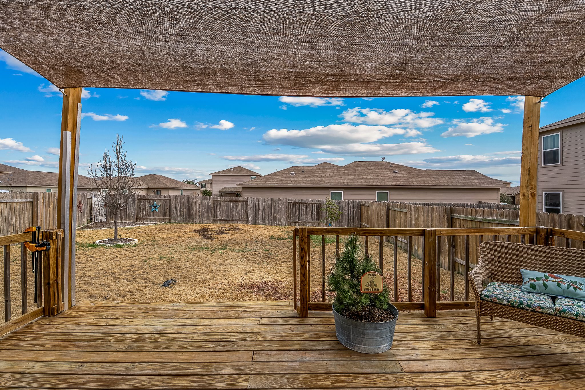 100 Wincliff Cove, Unit 13D Jarrell, TX 76537 - Photo 28 of 40 a view of a balcony with chair and wooden floor