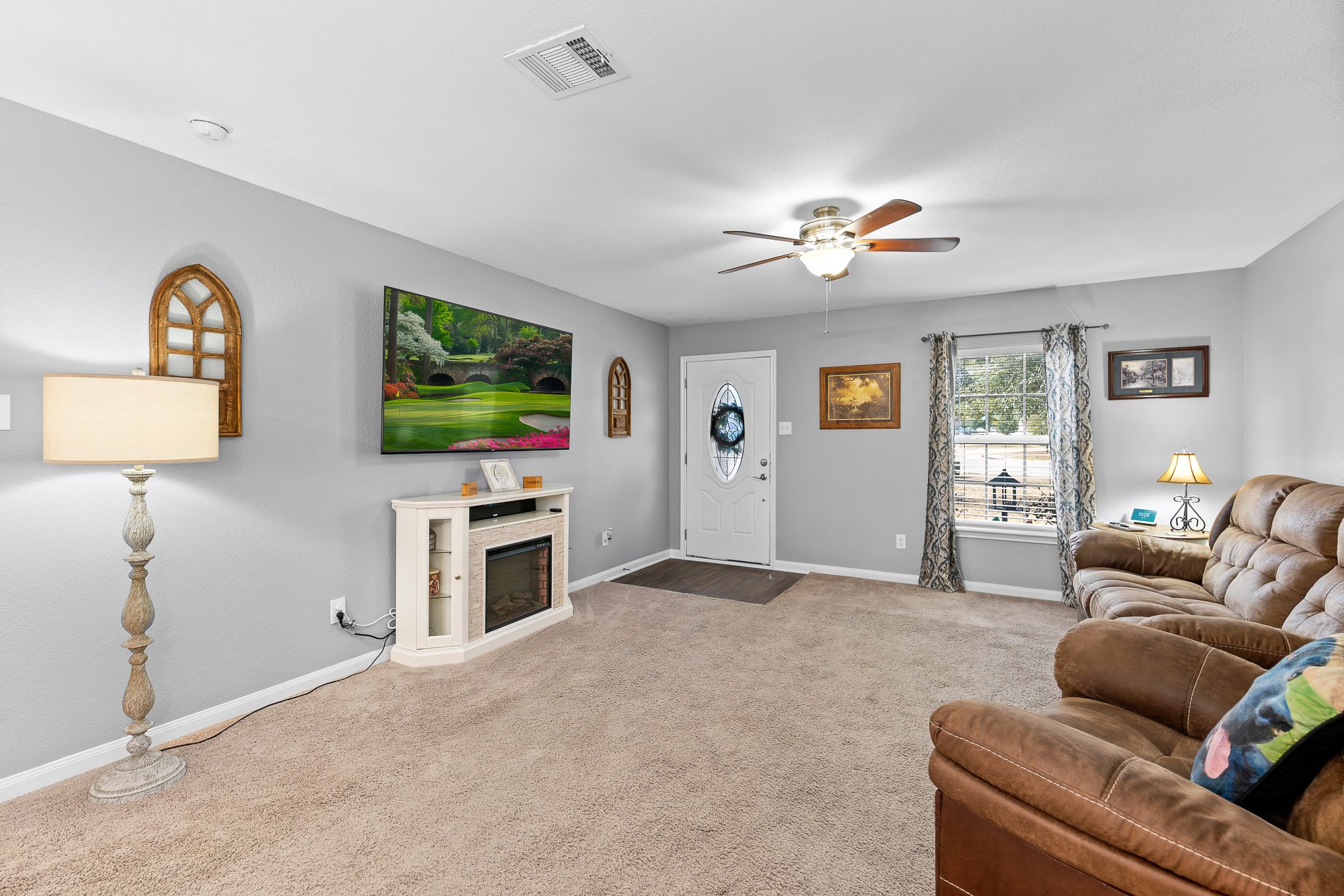 100 Wincliff Cove, Unit 13D Jarrell, TX 76537 - Photo 6 of 40 a living room with furniture and a flat screen tv