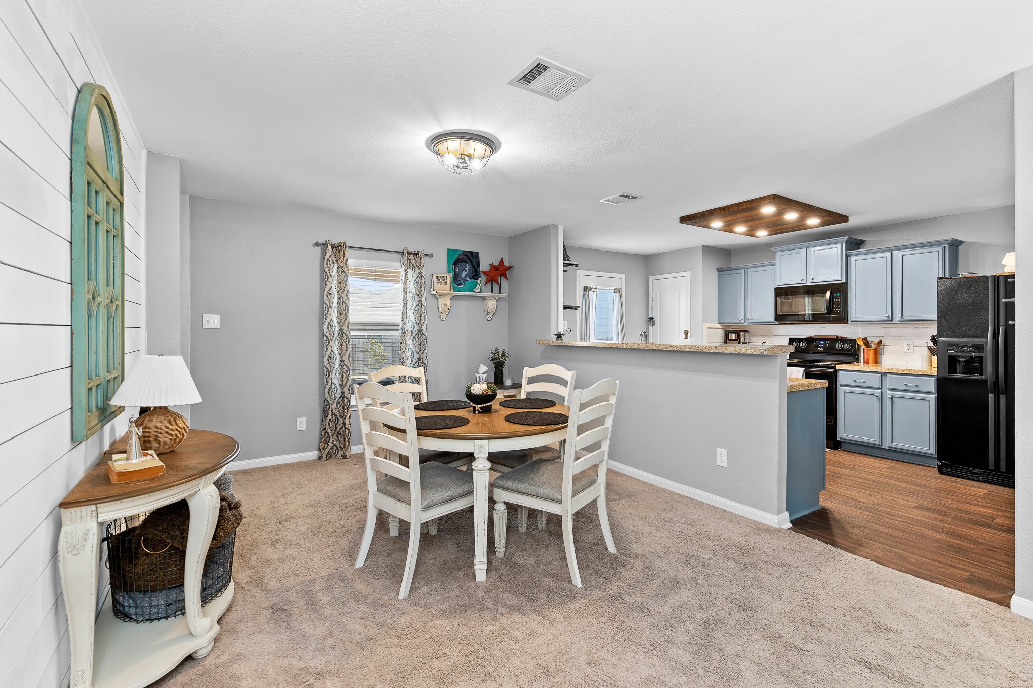 100 Wincliff Cove, Unit 13D Jarrell, TX 76537 - Photo 8 of 40 a view of a dining room with furniture and a kitchen