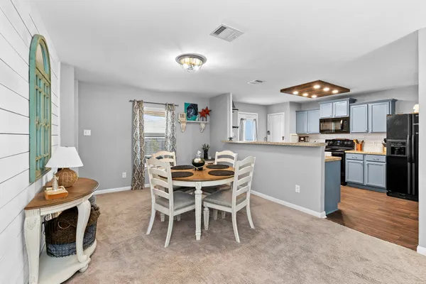 a kitchen with stainless steel appliances granite countertop a stove and a sink