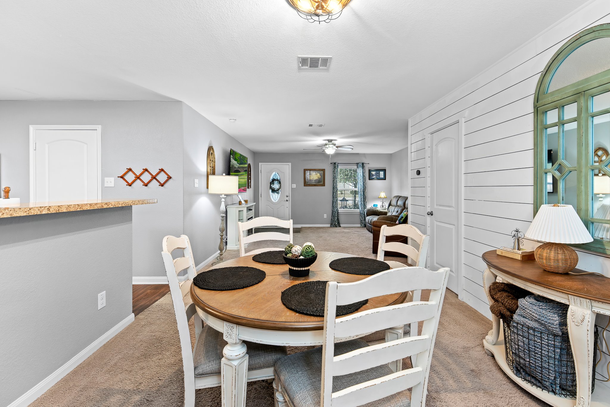 100 Wincliff Cove, Unit 13D Jarrell, TX 76537 - Photo 10 of 40 a view of a dining room with furniture and wooden floor