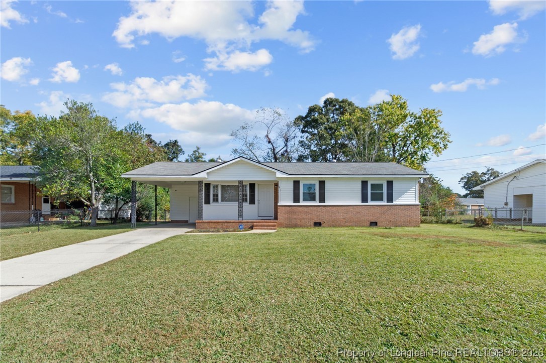 5414 Plateau Road Fayetteville, NC 28303 - Photo 1 of 27 a front view of a house with a garden