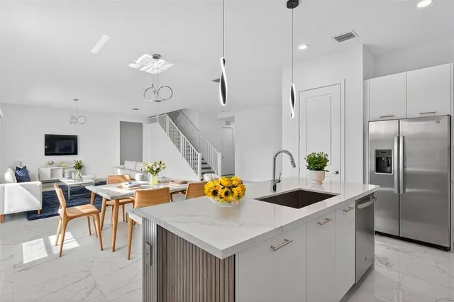 a view of an entryway with wooden floor