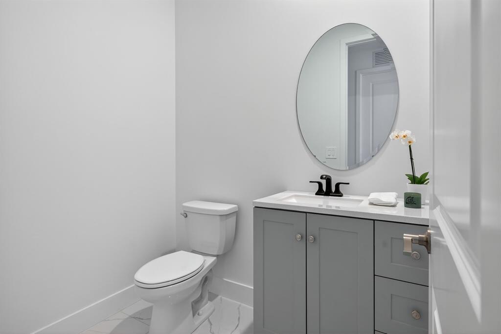 4421 Southwest 123rd Avenue Davie, FL 33330 - Photo 20 of 62 a bathroom with a toilet sink and mirror