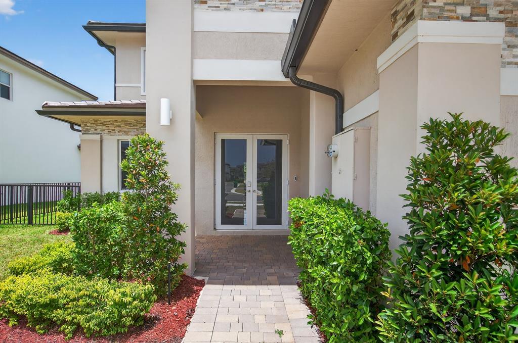 4421 Southwest 123rd Avenue Davie, FL 33330 - Photo 2 of 62 a front view of a house with garden
